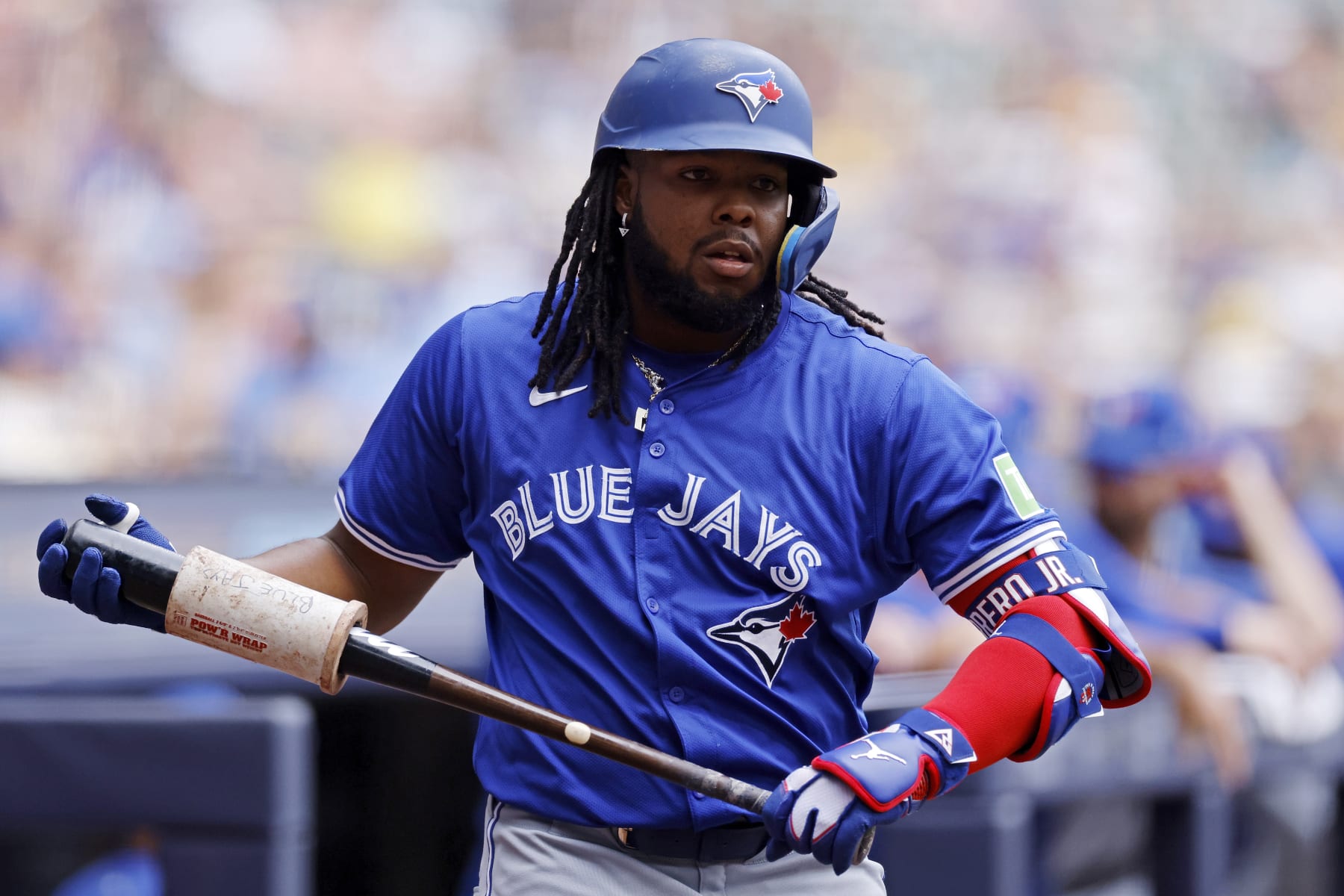 MILWAUKEE, WI - JUNE 12: Toronto Blue Jays first baseman Vladimir Guerrero Jr. (27) looks on before pinch hitting in the ninth inning during an MLB game against the Milwaukee Brewers on June 12, 2024 at American Family Field in Milwaukee, Wisconsin. (Photo by Joe Robbins/Icon Sportswire via Getty Images)