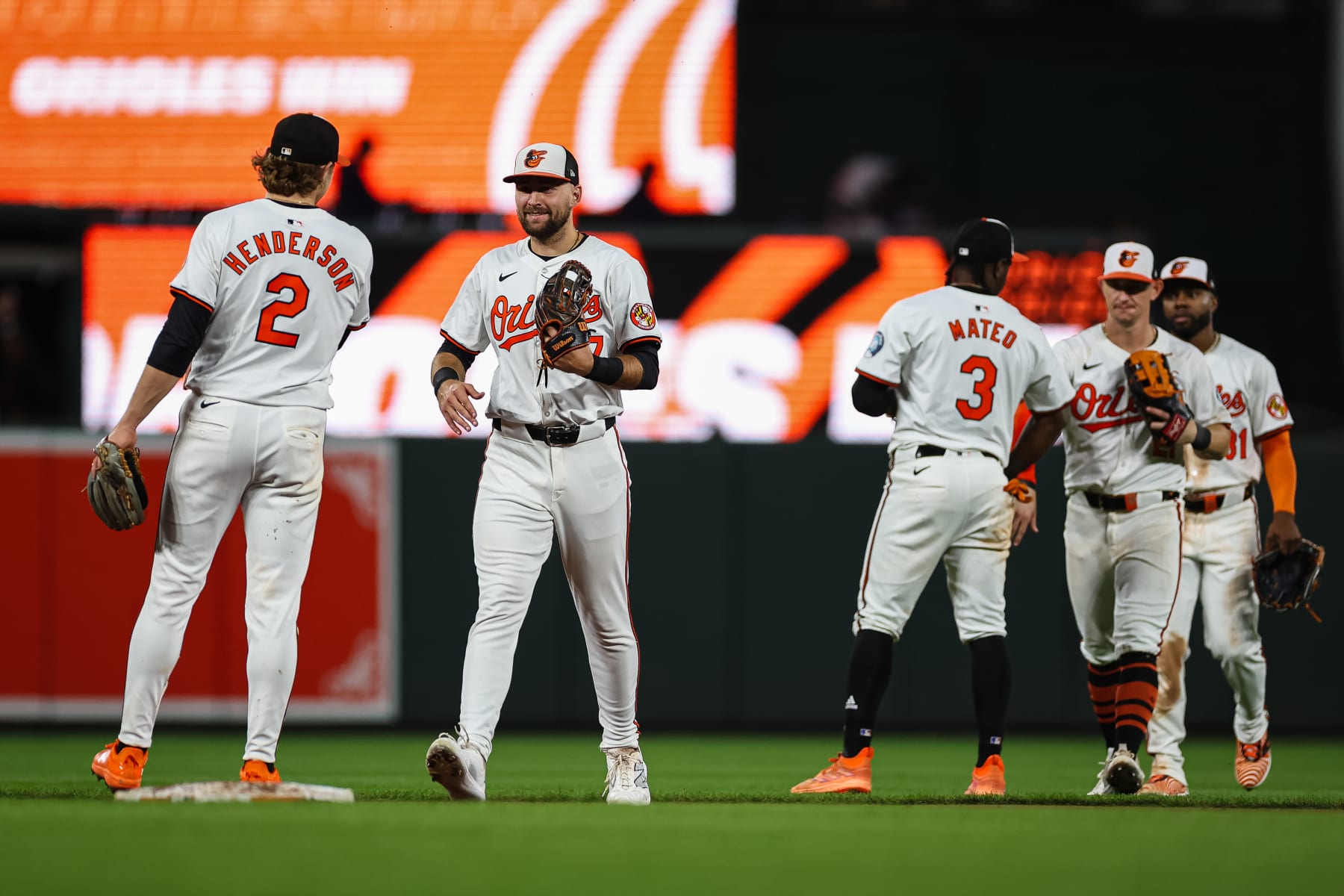 BALTIMORE, MD - JUNE 12: Gunnar Henderson #2 and Colton Cowser #17 of the Baltimore Orioles celebrate after the final out of the game against the Atlanta Braves at Oriole Park at Camden Yards on June 12, 2024 in Baltimore, Maryland. (Photo by Scott Taetsch/Getty Images)