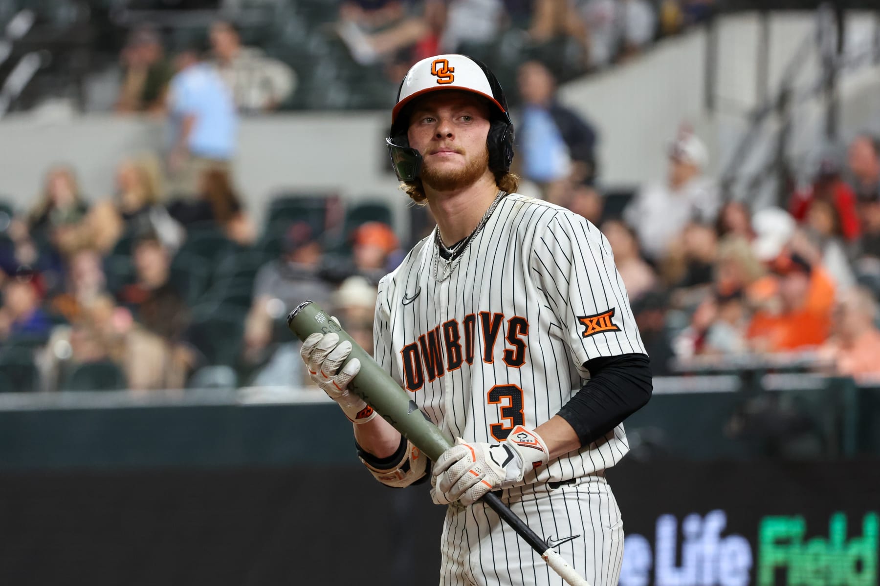 ARLINGTON, TX - MAY 22: Oklahoma State utility Carson Benge (3) stands in the batter's circle during the 2024 Phillips 66 Big 12 Baseball Championship game between Oklahoma State and Texas Tech on May 22, 2024, at Globe Life Field in Arlington, TX. (Photo by David Buono/Icon Sportswire via Getty Images)