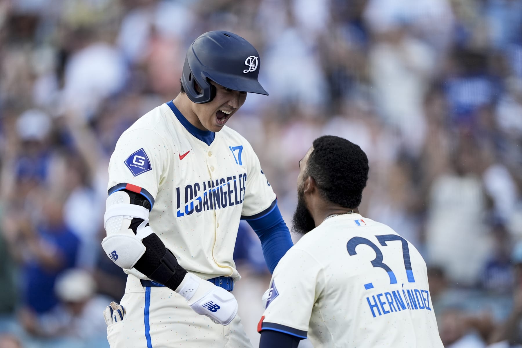 LOS ANGELES, CALIFORNIA - JULY 06: Shohei Ohtani #17 of the Los Angeles Dodgers celebrates with his teammate Teoscar Hernández #37 after hitting a solo home run against the Milwaukee Brewers during the eighth inning at Dodger Stadium on July 06, 2024 in Los Angeles, California. (Photo by Michael Owens/Getty Images)