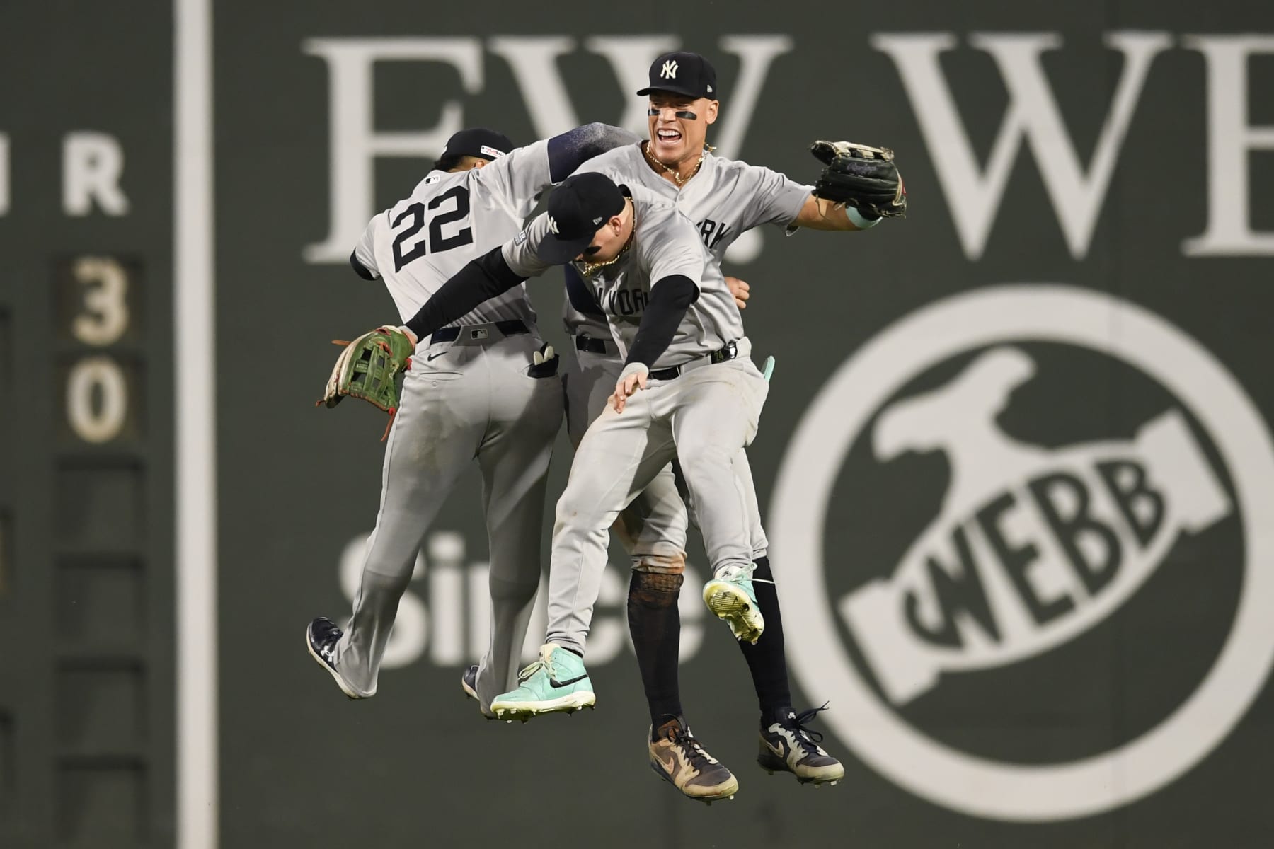 BOSTON, MASSACHUSETTS - JUNE 14: (L-R) Juan Soto #22, Alex Verdugo #24 and Aaron Judge #99 of the New York Yankees celebrate their ninth inning win over the Boston Red Sox at Fenway Park on June 14, 2024 in Boston, Massachusetts. (Photo by Jaiden Tripi/Getty Images)