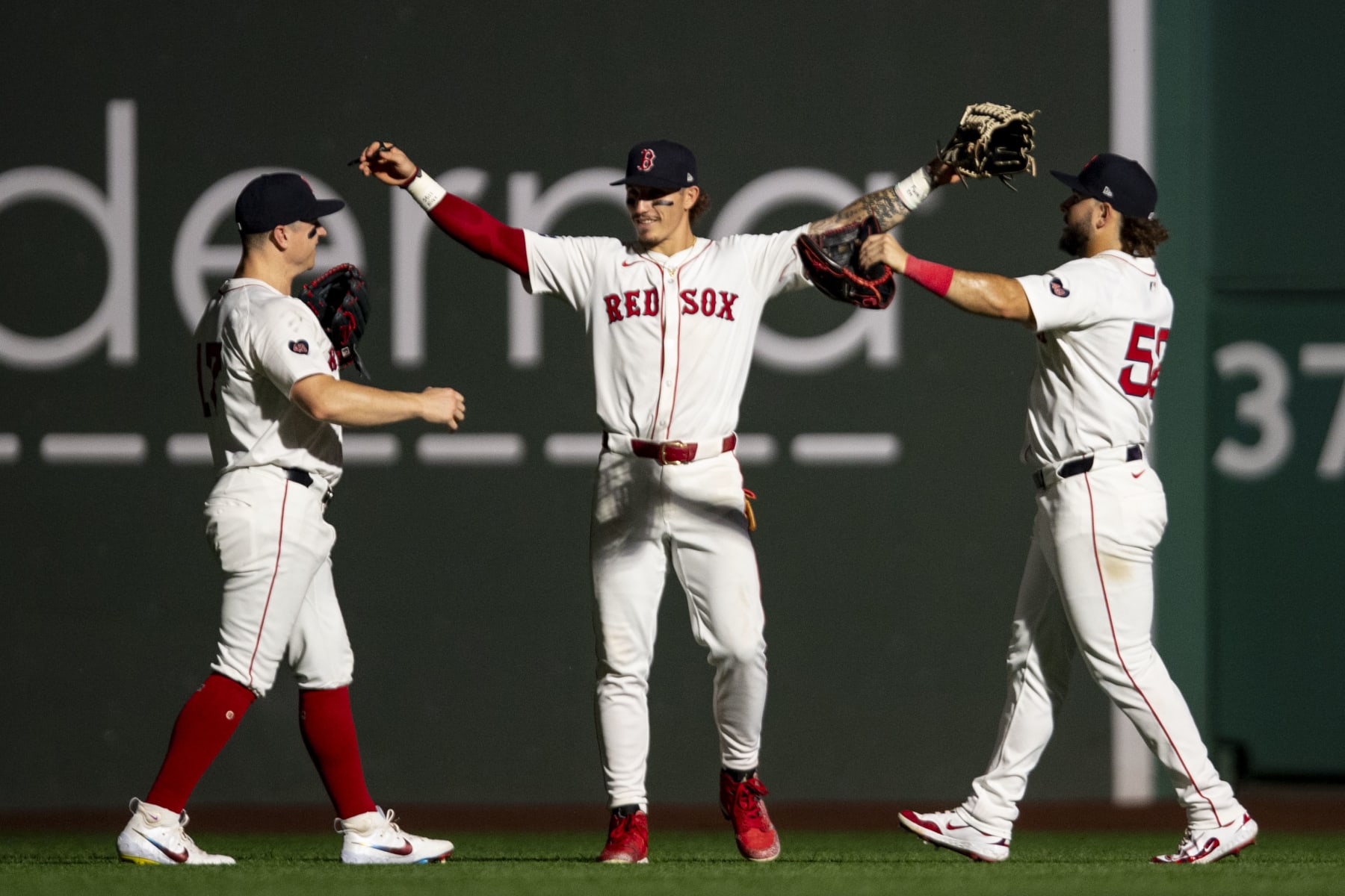 BOSTON, MA - JULY 9: Tyler O'Neill #17, Jarren Duran #16, and Wilyer Abreu #52 of the Boston Red Sox celebrate a victory against the Oakland Athletics on July 9, 2024 at Fenway Park in Boston, Massachusetts. (Photo by Billie Weiss/Boston Red Sox/Getty Images)