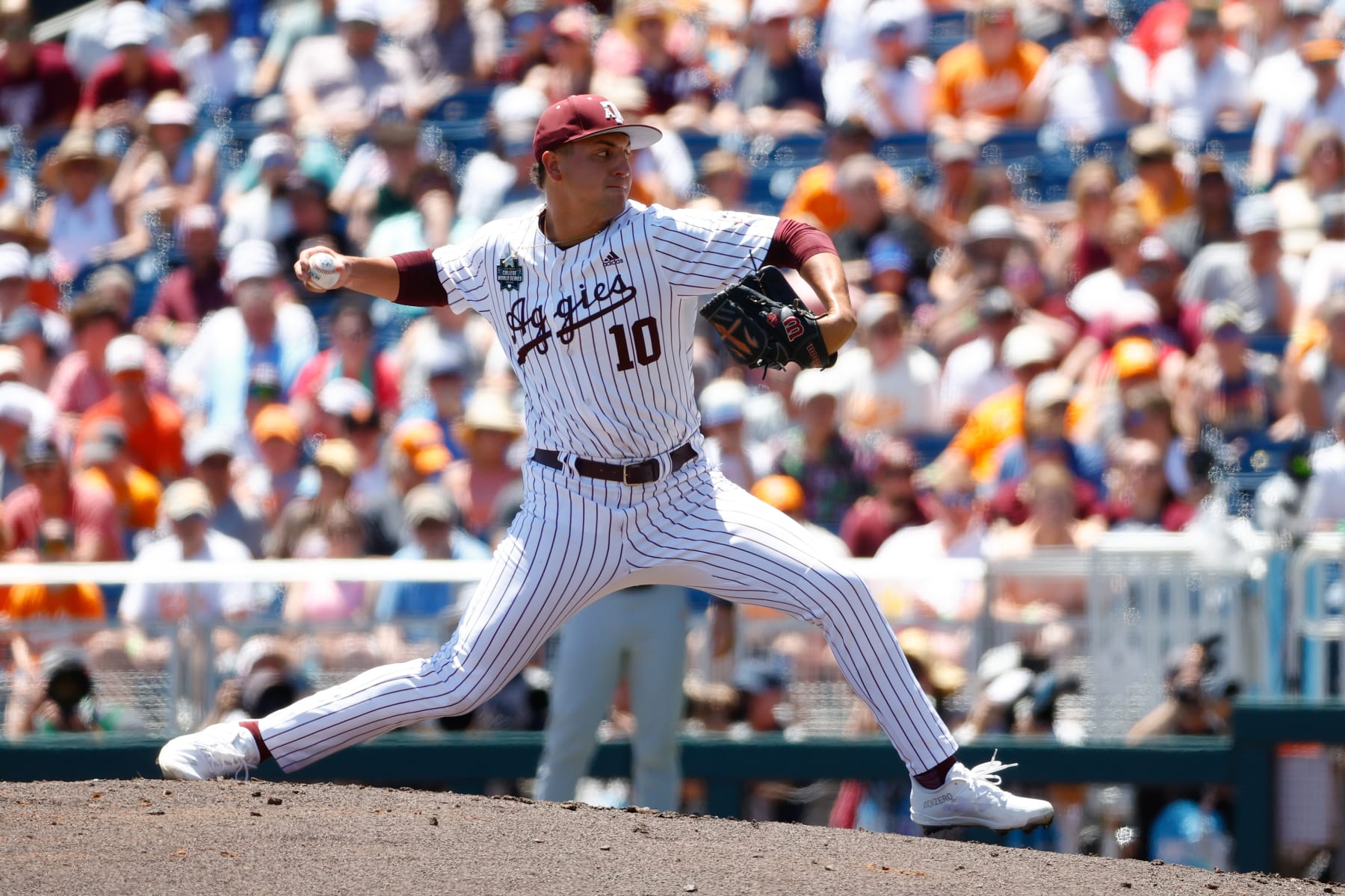 OMAHA, NEBRASKA - JUNE 23: Chris Cortez #10 of the Texas A&M Aggies delivers a pitch against the Tennessee Volunteers during game two of the Division I Men's Baseball Championship held at Charles Schwab Field on June 23, 2024 in Omaha, Nebraska.  (Photo by C. Morgan Engel/NCAA Photos via Getty Images)