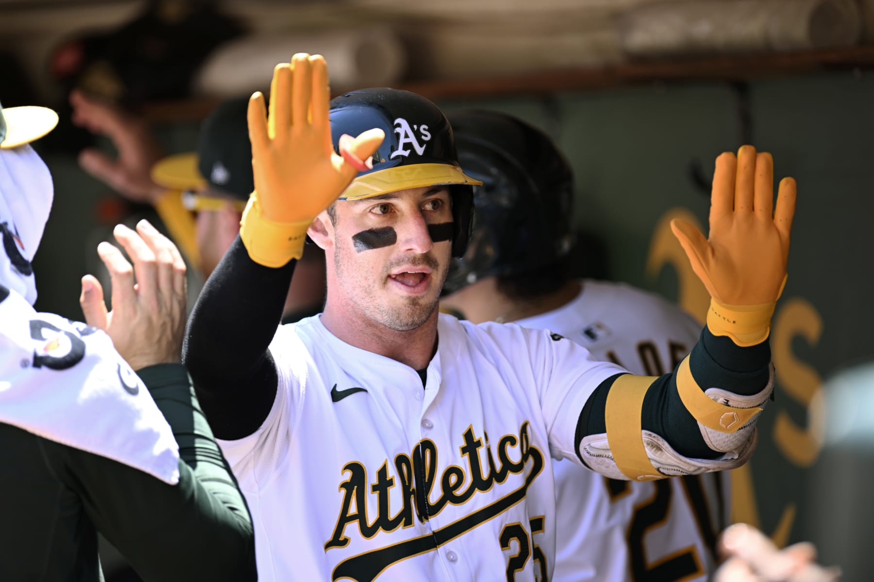 OAKLAND, CALIFORNIA - JULY 06: Brent Rooker #25 of the Oakland Athletics celebrates his three-run home run in the dugout against the Baltimore Orioles in the first inning at Oakland Coliseum on July 6, 2024 in Oakland, California. (Photo by Eakin Howard/Getty Images)