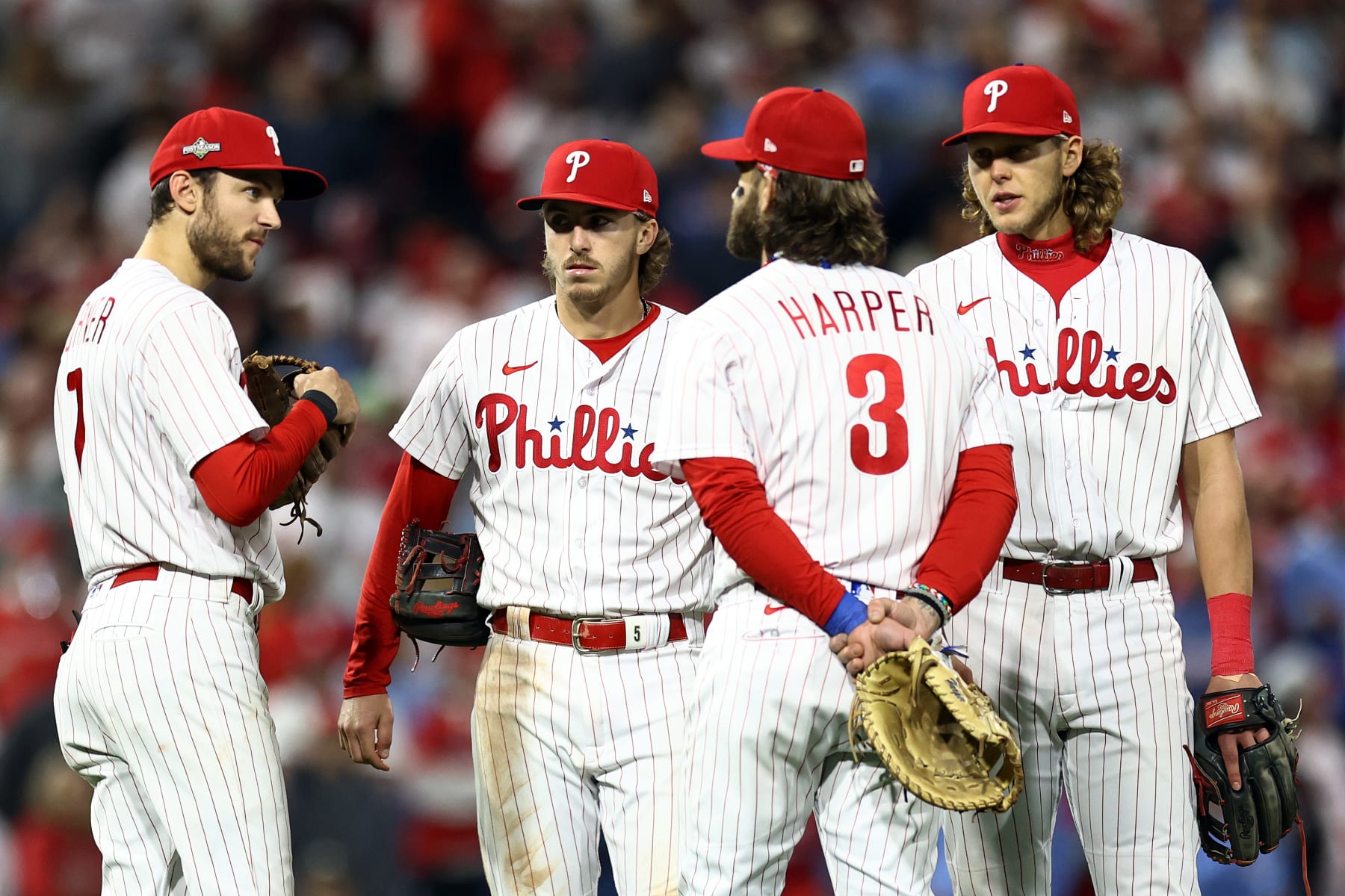 PHILADELPHIA, PENNSYLVANIA - OCTOBER 24: Trea Turner #7, Bryson Stott #5, Bryce Harper #3 and Alec Bohm #28 of the Philadelphia Phillies look on during a pitching change in the seventh inning against the Arizona Diamondbacks in Game Seven of the Championship Series at Citizens Bank Park on October 24, 2023 in Philadelphia, Pennsylvania. (Photo by Tim Nwachukwu/Getty Images)
