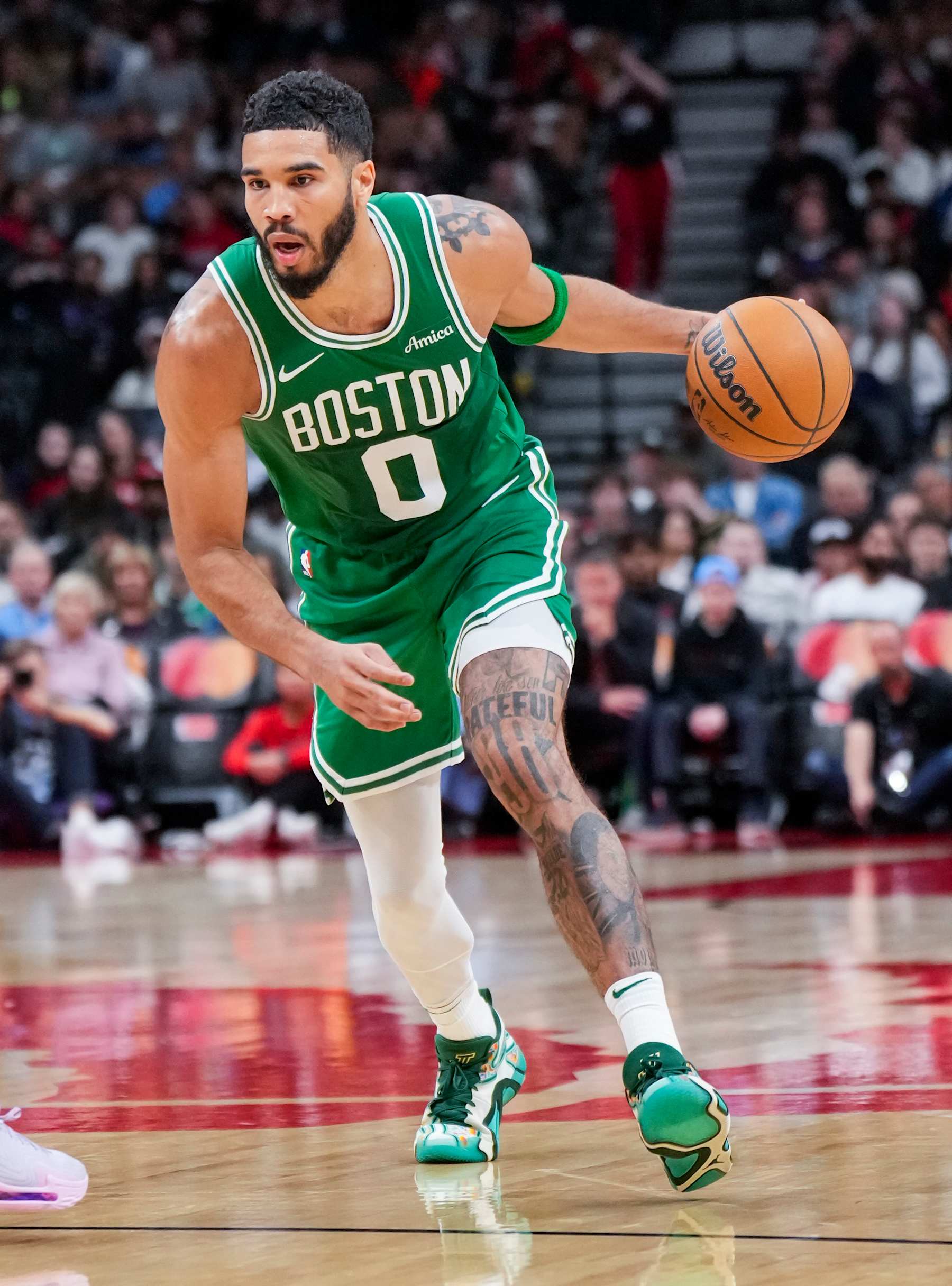 TORONTO, ON - OCTOBER 15: Jayson Tatum #0 of the Boston Celtics dribbles against the Toronto Raptors during the first half of their preseason basketball game at the Scotiabank Arena on October 15, 2024 in Toronto, Ontario, Canada. NOTE TO USER: User expressly acknowledges and agrees that, by downloading and/or using this Photograph, user is consenting to the terms and conditions of the Getty Images License Agreement. (Photo by Mark Blinch/Getty Images)