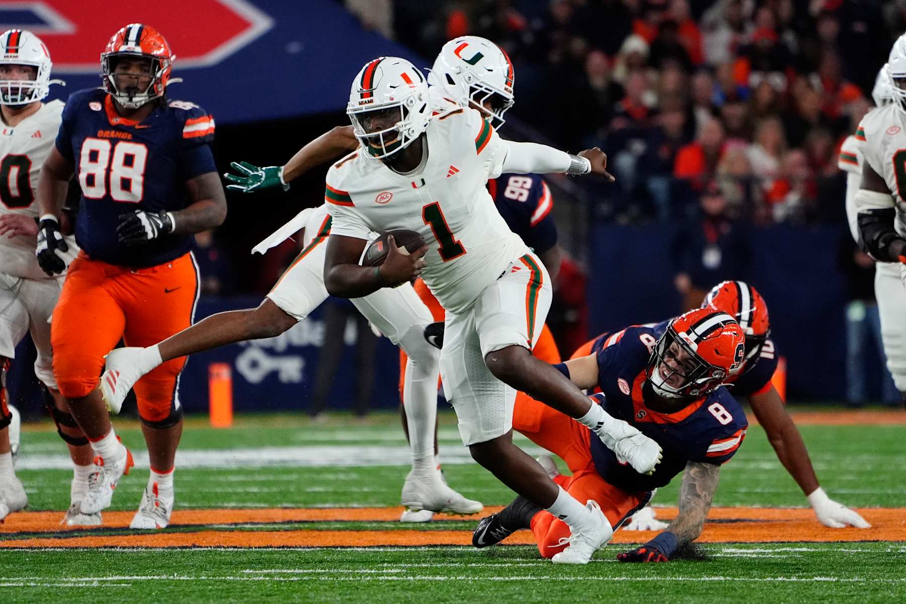 SYRACUSE, NY - NOVEMBER 30: Miami Hurricanes Quarterback Cam Ward (1) runs with the ball during the second half of the College Football game between the Miami Hurricanes and the Syracuse Orange on November 30, 2024, at the JMA Wireless Dome in Syracuse, NY. (Photo by Gregory Fisher/Icon Sportswire via Getty Images)