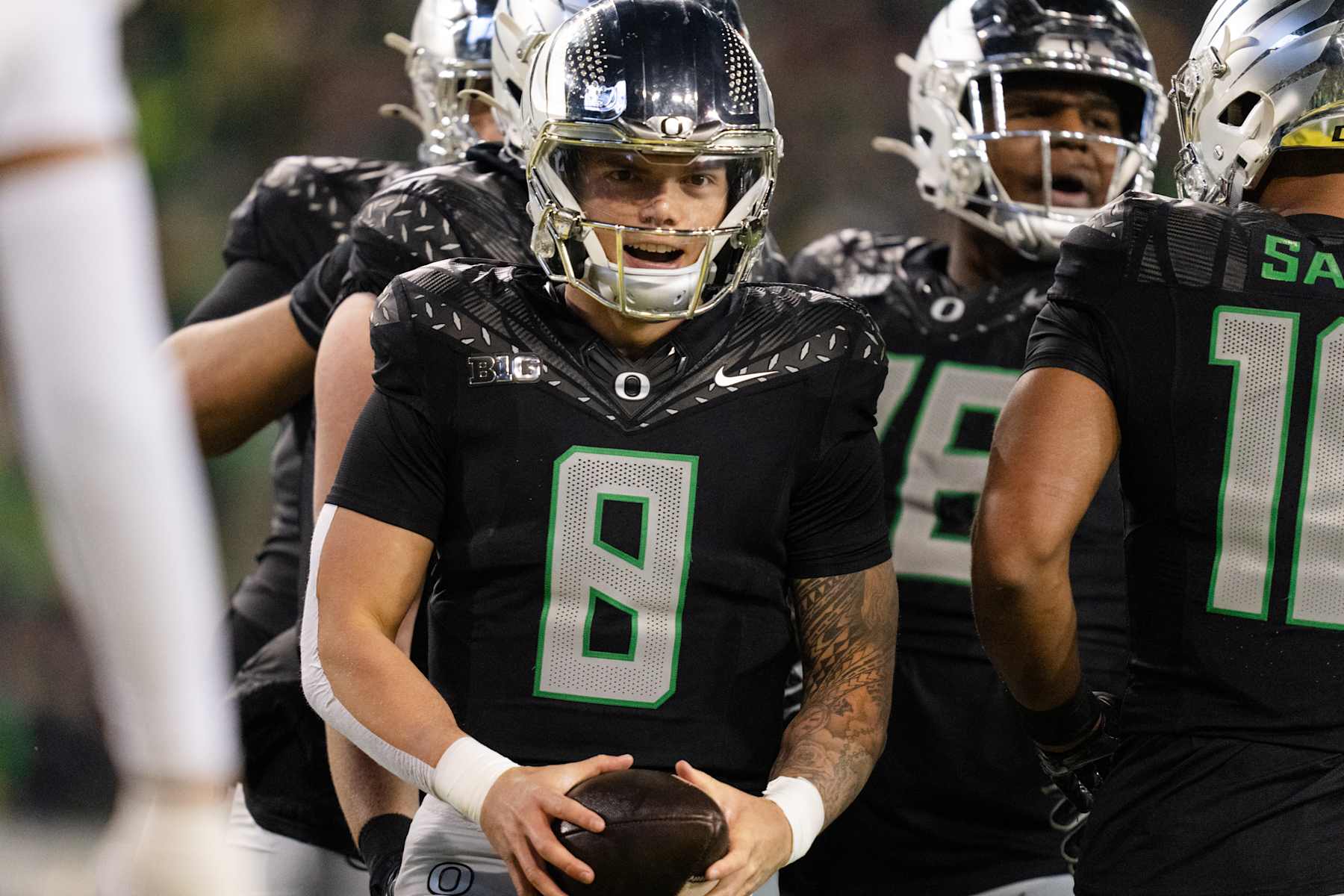 EUGENE, OREGON - NOVEMBER 30: Quarterback Dillon Gabriel #8 of the Oregon Ducks reacts after scoring a touchdown during the first half of the game against the Washington Huskies at Autzen Stadium on November 30, 2024 in Eugene, Oregon. (Photo by Ali Gradischer/Getty Images)
