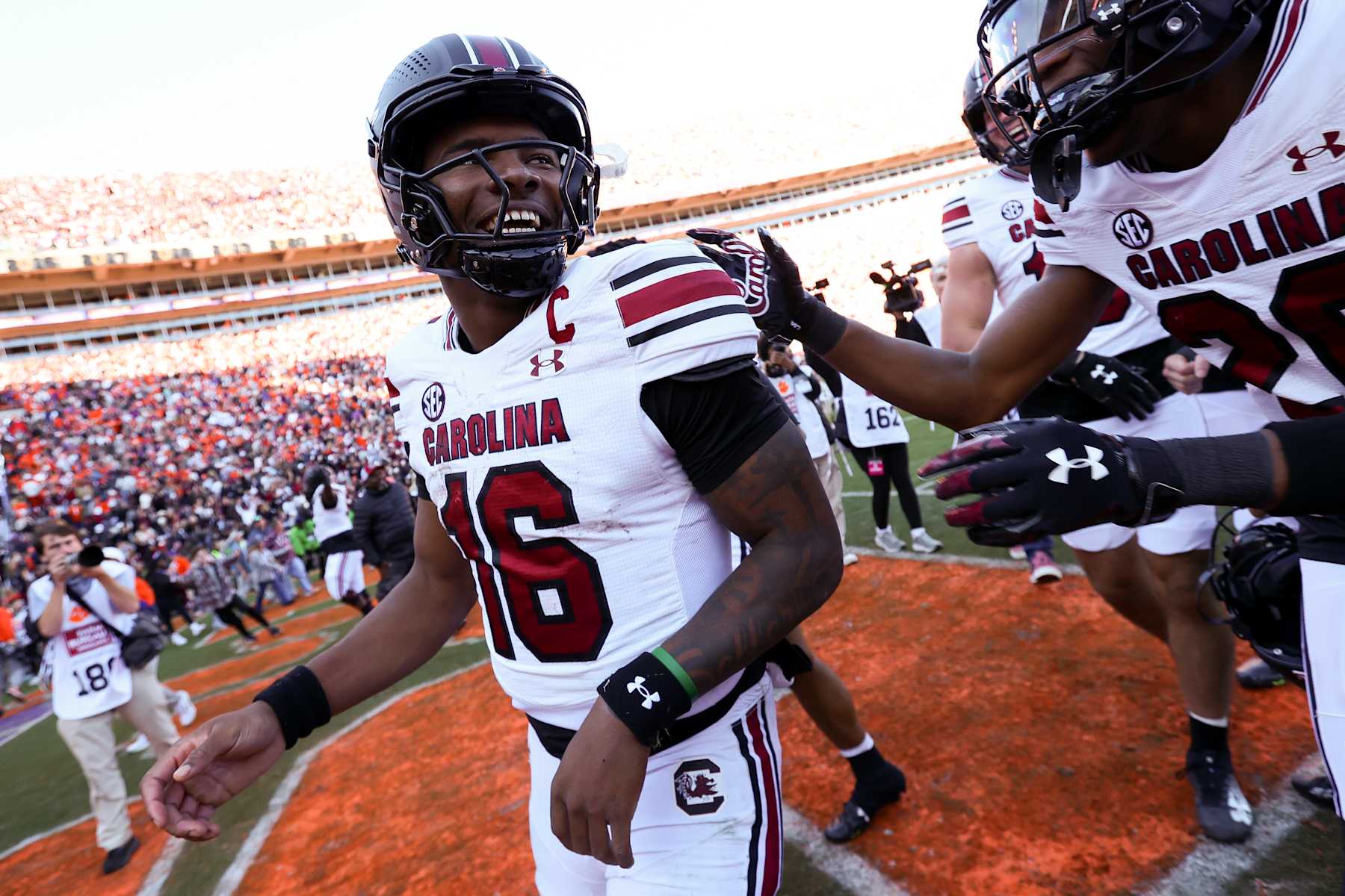 CLEMSON, SOUTH CAROLINA - NOVEMBER 30: LaNorris Sellers #16 of the South Carolina Gamecocks celebrates with the team after defeating the Clemson Tigers, 17-14, at Memorial Stadium on November 30, 2024 in Clemson, South Carolina.  (Photo by Isaiah Vazquez/Getty Images)