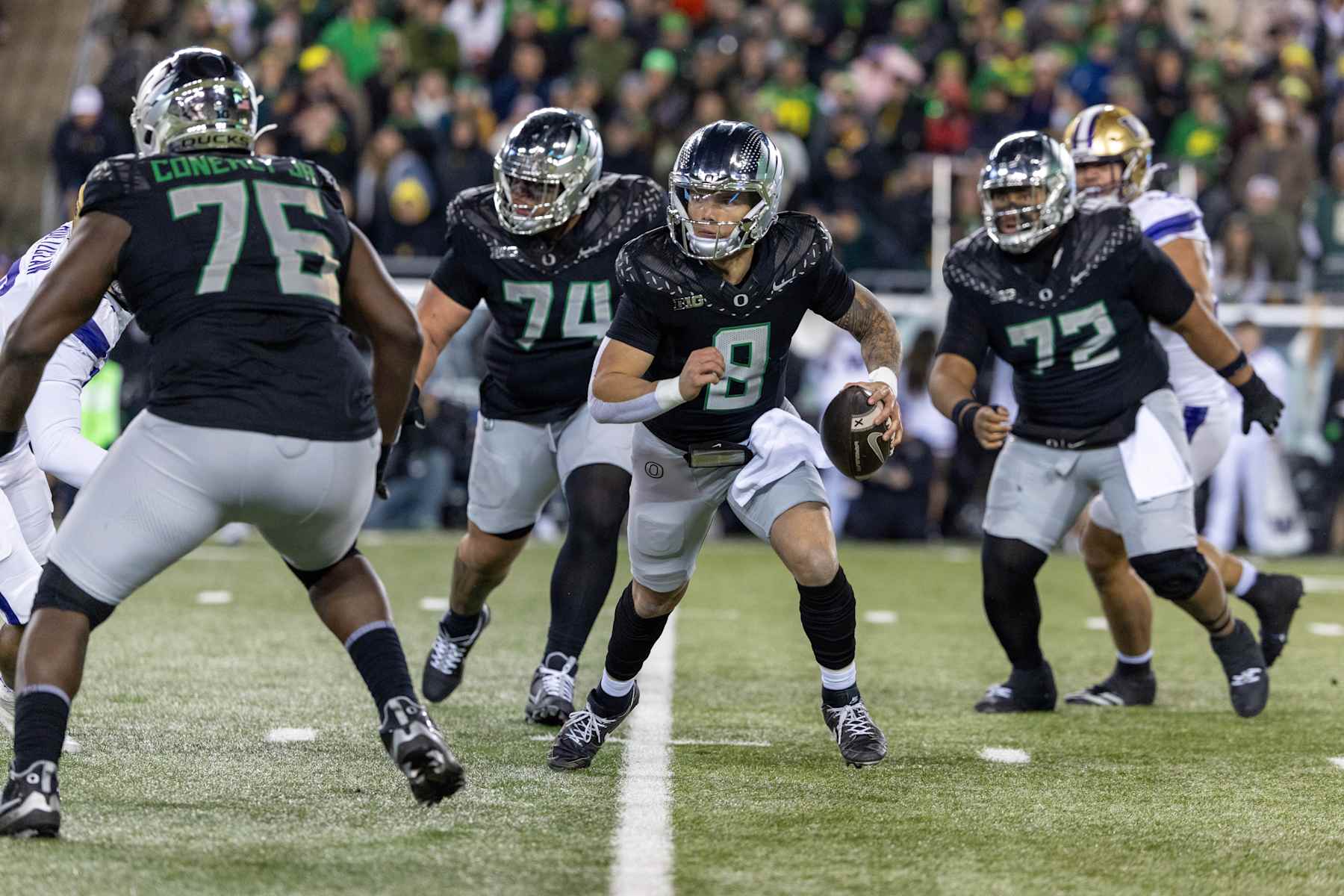 EUGENE, OREGON - NOVEMBER 30: Quarterback Dillon Gabriel #8 of the Oregon Ducks runs to pass the ball in the first half against the Washington Huskies at Autzen Stadium on November 30, 2024 in Eugene, Oregon.  (Photo by Tom Hauck/Getty Images)