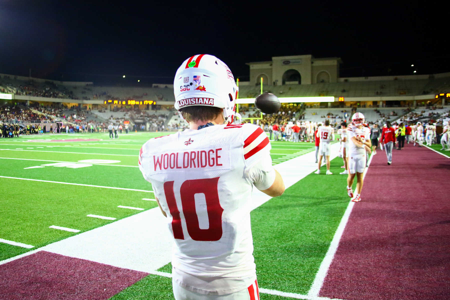 SAN MARCOS, TX - OCTOBER 29: Louisiana Ragin' Cajuns Quarterback Ben Wooldridge (10) warms up on the sideline during the game between Louisiana Ragin' Cajuns and Texas State Bobcats on October 29th, 2024 at UFCU Bobcat Stadium in San Marcos, TX.(Photo by Martin Leitch/Icon Sportswire via Getty Images)