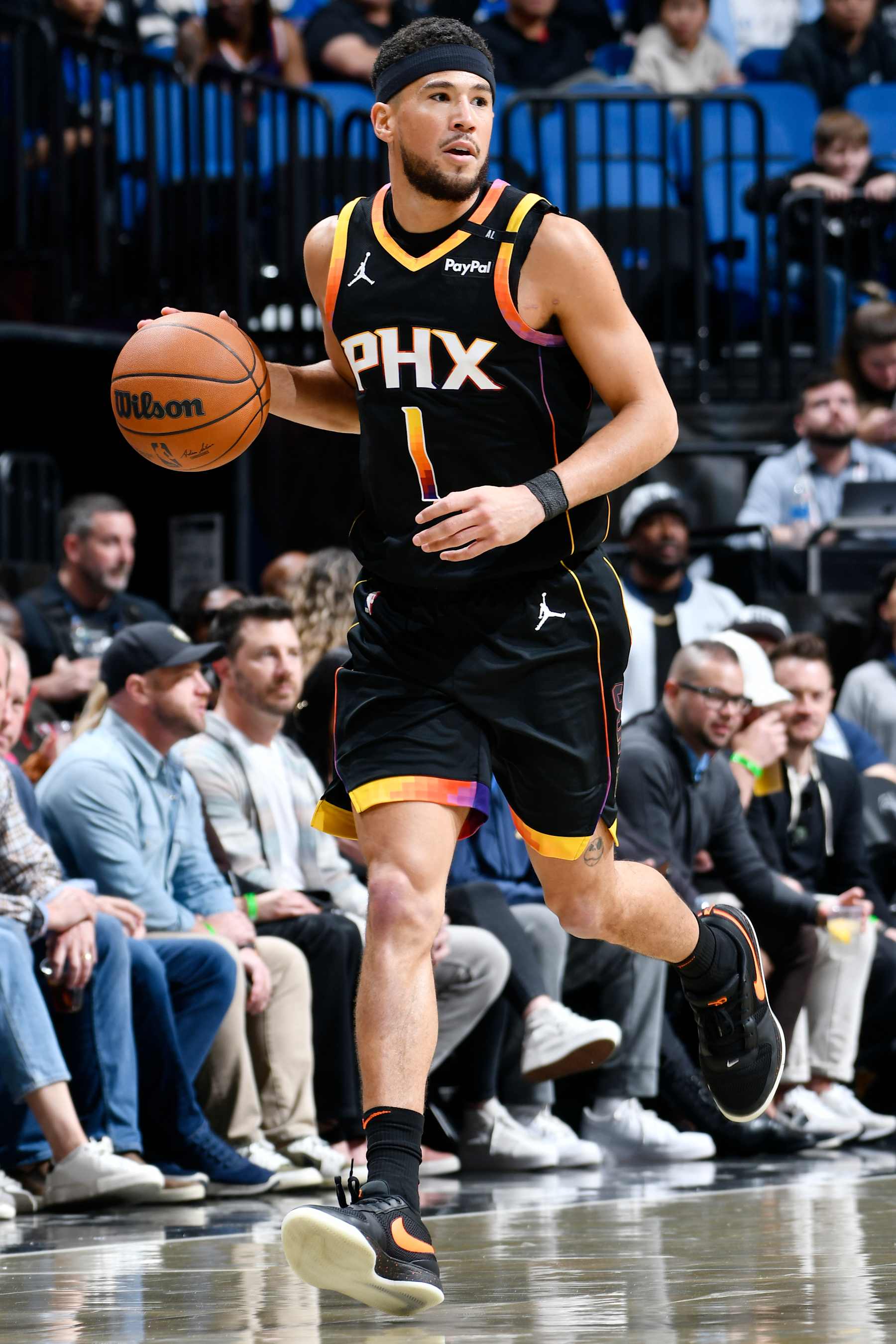 ORLANDO, FL - DECEMBER 8: Devin Booker #1 of the Phoenix Suns dribbles the ball during the game against the Orlando Magic on December 8, 2024 at Amway Center in Orlando, Florida. NOTE TO USER: User expressly acknowledges and agrees that, by downloading and or using this photograph, User is consenting to the terms and conditions of the Getty Images License Agreement. Mandatory Copyright Notice: Copyright 2024 NBAE (Photo by Fernando Medina/NBAE via Getty Images)