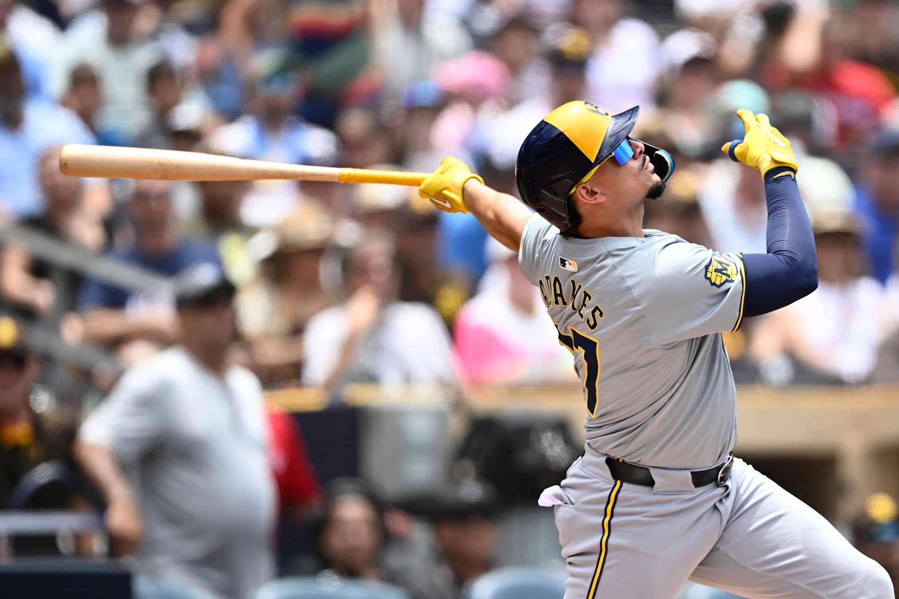 SAN DIEGO, CA - JUNE 23:  Willy Adames #27 of the Milwaukee Brewers hits a single during the second inning of a baseball game against the San Diego Padres June 23, 2024 at Petco Park in San Diego, California. (Photo by Denis Poroy/Getty Images)