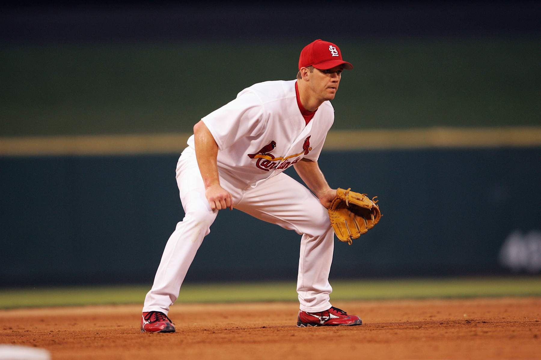 ST. LOUIS - JUNE 28:  Scott Rolen #27 of the St. Louis Cardinals plays third base during the game against the Cincinnati Reds on June 28, 2005 at Busch Stadium in St. Louis, Missouri. (Photo by Elsa/Getty Images). 