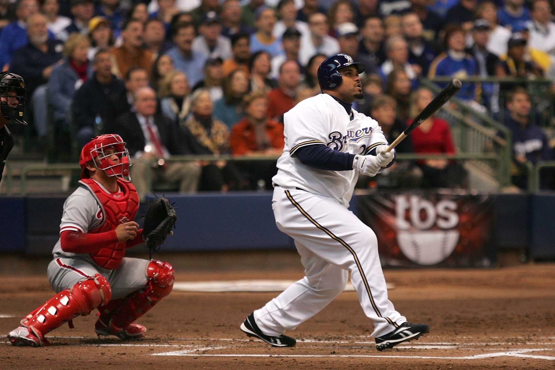 MILWAUKEE - OCTOBER 04:  Prince Fielder #28 of the Milwaukee Brewers hits a sacrifice fly to drive in Mike Cameron #25 in the bottom of the second inning against the Philadelphia Phillies in Game three of the NLDS during the 2008 MLB playoffs at Miller Park on October 4, 2008 in Milwaukee, Wisconsin.  (Photo by Jim McIsaac/Getty Images)