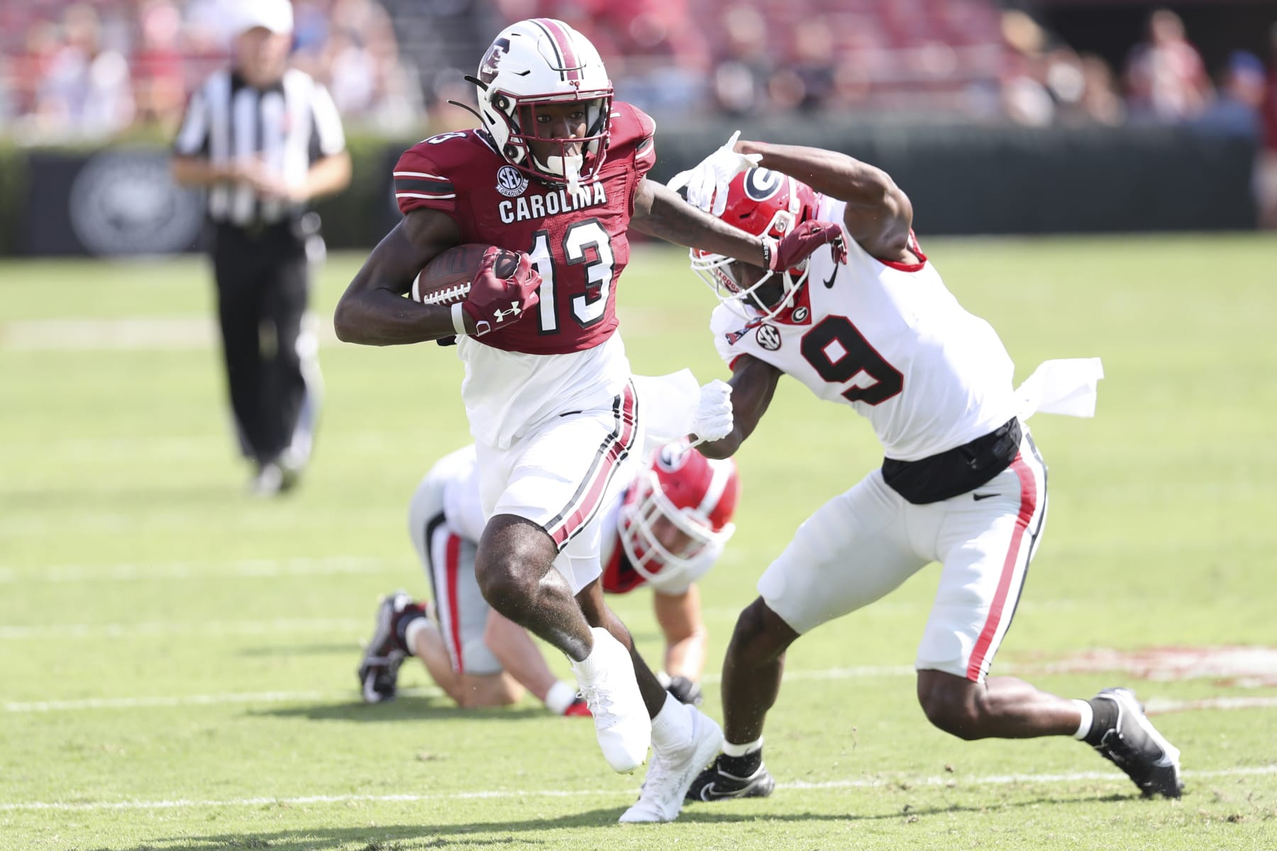 South Carolina wide receiver Jalen Brooks (13) breaks away from Georgia defensive back Jaheim Singletary (9) during the second half of an NCAA college football game on Saturday, Sept. 17, 2022 in Columbia, S.C. (AP Photo/Artie Walker Jr.)