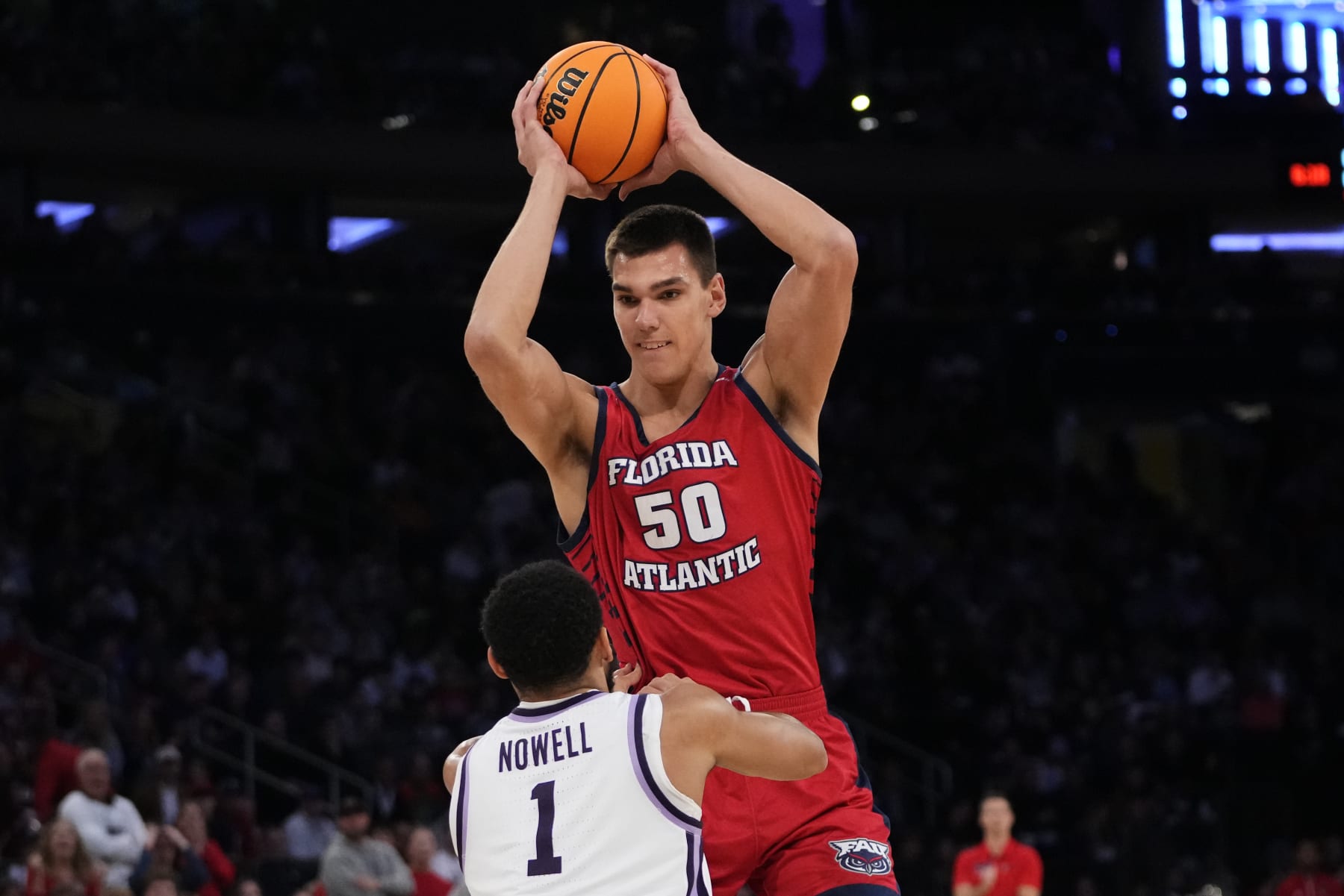 Florida Atlantic's Vladislav Goldin (50) grabs a rebound over Kansas State's Markquis Nowell (1) in the first half of an Elite 8 college basketball game in the NCAA Tournament's East Region final, Saturday, March 25, 2023, in New York. (AP Photo/Frank Franklin II)