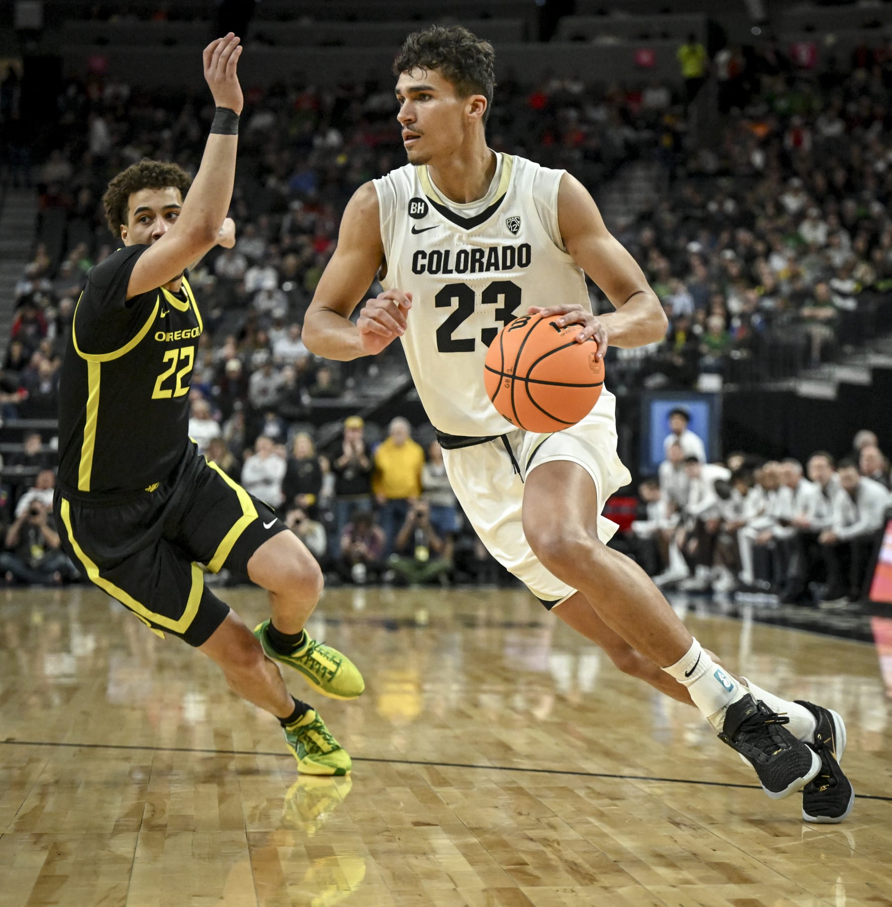LAS VEGAS, NV - MARCH 16: Tristan da Silva (23) of the Colorado Buffaloes drives past Jadrian Tracey (22) of the Oregon Ducks during the first half of the Pac-12 Tournament championship game at T-Mobile Arena in Las Vegas, Nevada on Saturday, March 16, 2024. (Photo by AAron Ontiveroz/The Denver Post)