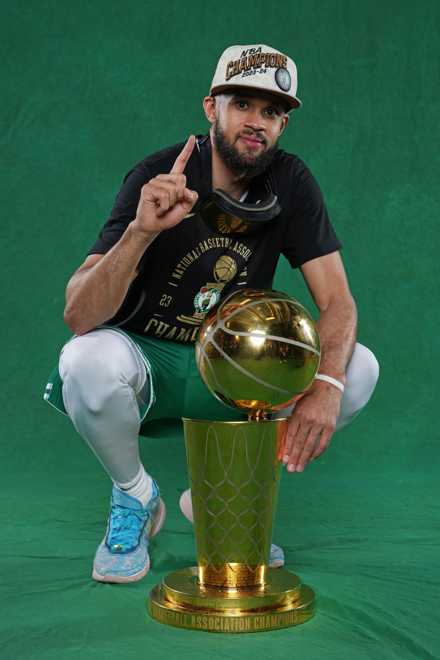 BOSTON, MA - JUNE 17: Derrick White #9 of the Boston Celtics poses for a portrait with the Larry O'Brian Trophy after winning Game 5 of the 2024 NBA Finals on June 17, 2024 at the TD Garden in Boston, Massachusetts. NOTE TO USER: User expressly acknowledges and agrees that, by downloading and or using this photograph, User is consenting to the terms and conditions of the Getty Images License Agreement. Mandatory Copyright Notice: Copyright 2024 NBAE  (Photo by Jesse D. Garrabrant/NBAE via Getty Images)