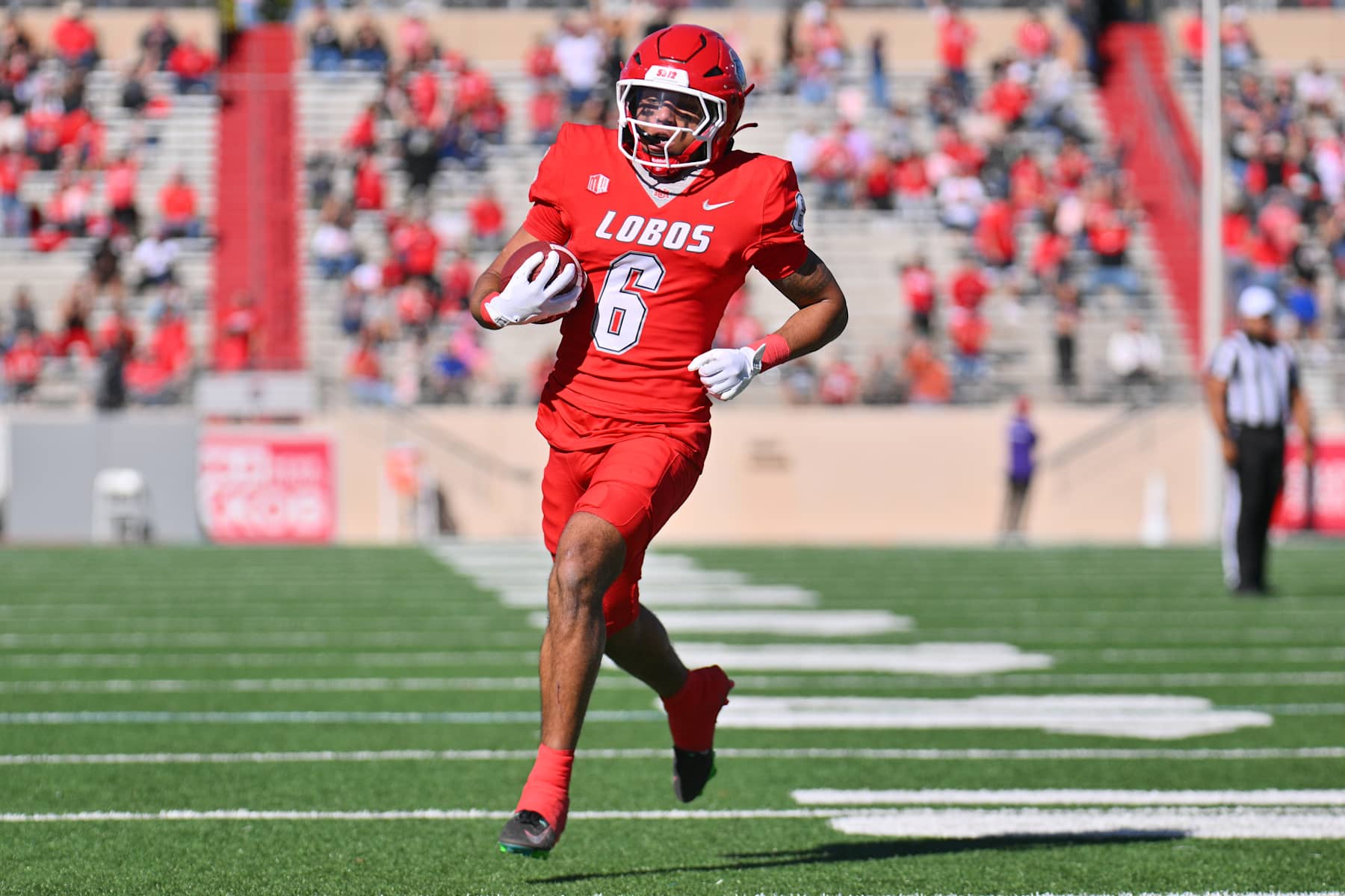 ALBUQUERQUE, NEW MEXICO - NOVEMBER 02: Running back Eli Sanders #6 of the New Mexico Lobos scores a touchdown against the Wyoming Cowboys during the first half of a game at University Stadium on November 02, 2024 in Albuquerque, New Mexico. (Photo by Sam Wasson/Getty Images)