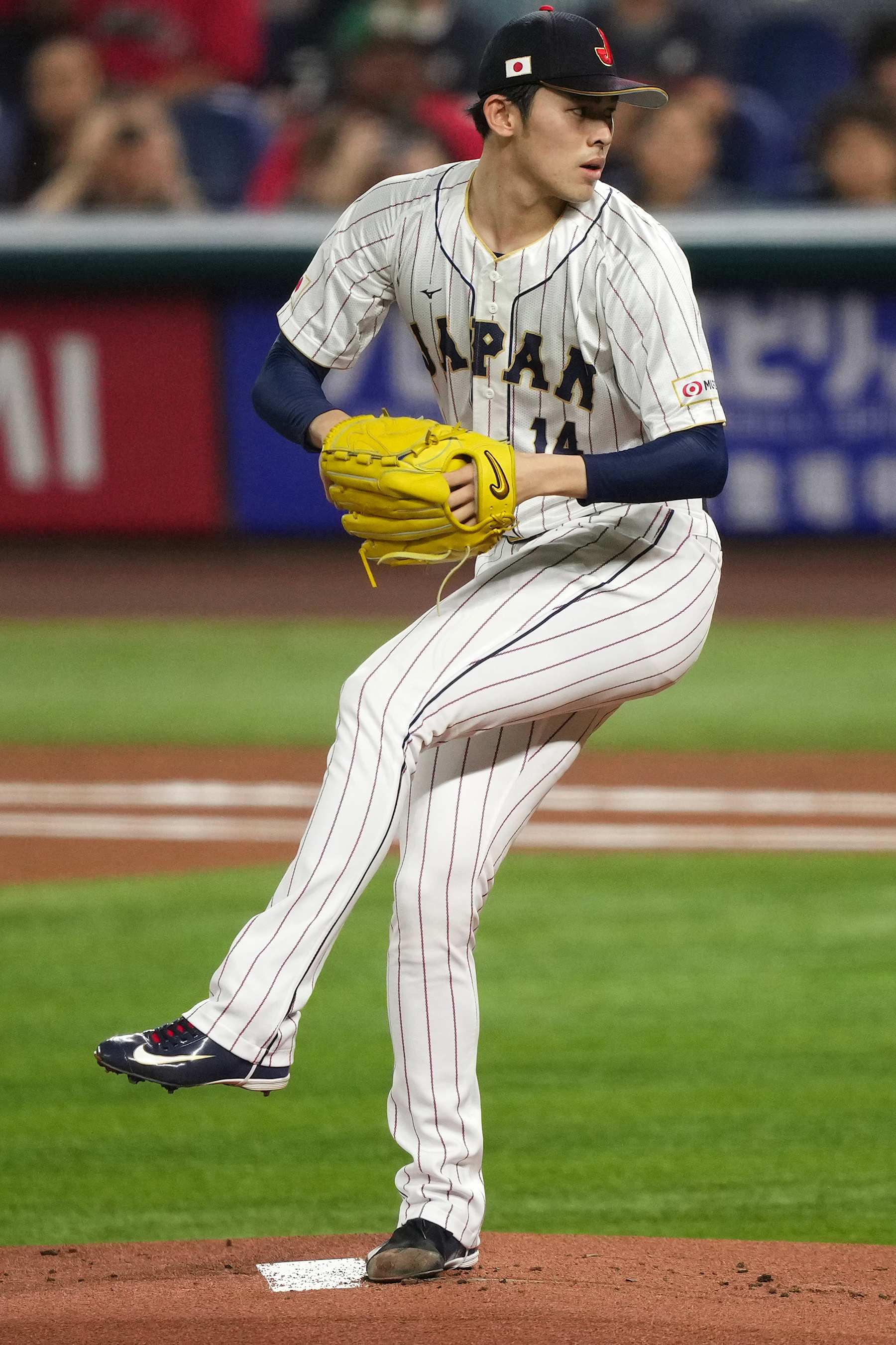 MIAMI, FL - MARCH 20: Roki Sasaki #14 of Japan delivers a pitch in the first inning against Mexico at loanDepot park on March 20, 2023 in Miami, Florida. (Photo by Jasen Vinlove/Miami Marlins/Getty Images)