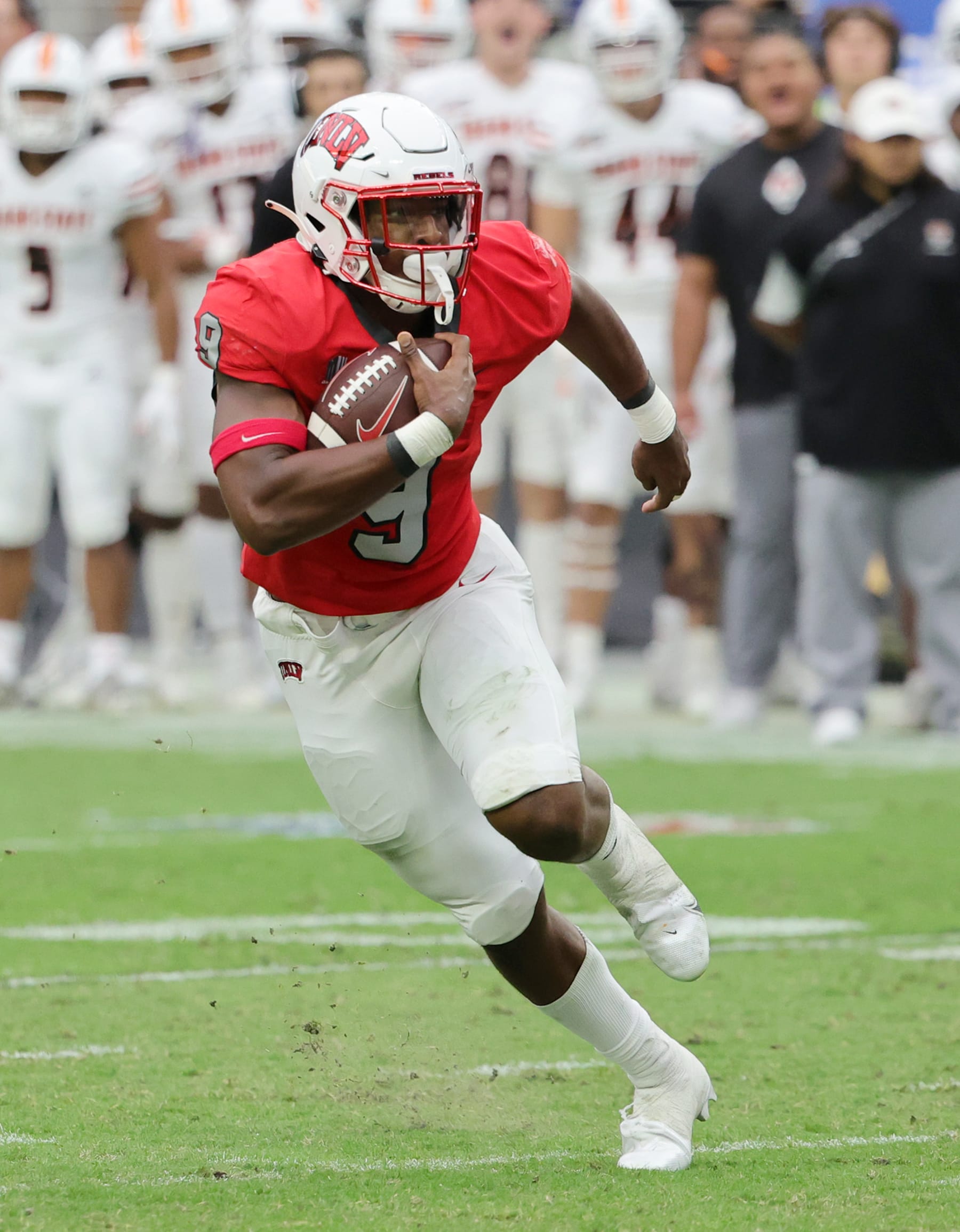 LAS VEGAS, NEVADA - AUGUST 27: Running back Aidan Robbins #9 of the UNLV Rebels runs for a first down against the Idaho State Bengals during their game at Allegiant Stadium on August 27, 2022 in Las Vegas, Nevada. The Rebels defeated the Bengals 52-21. (Photo by Ethan Miller/Getty Images)