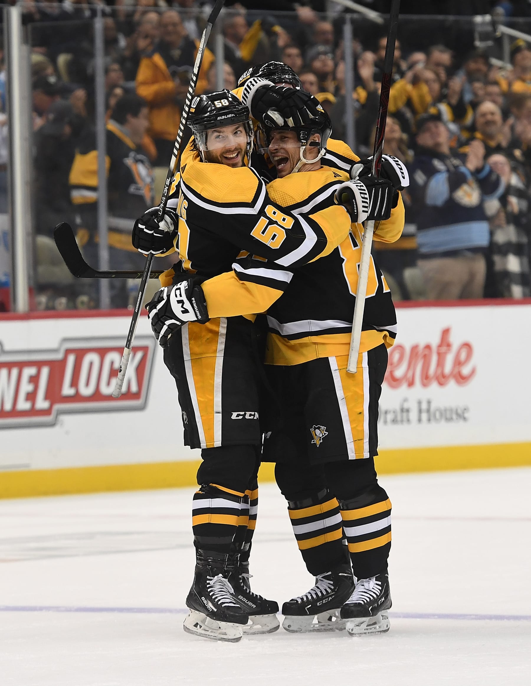 PITTSBURGH, PA - JANUARY 24: Kris Letang #58 of the Pittsburgh Penguins celebrates with Sidney Crosby #87 after scoring a goal in the first period during the game against the Florida Panthers at PPG PAINTS Arena on January 24, 2023 in Pittsburgh, Pennsylvania. (Photo by Justin Berl/Getty Images)