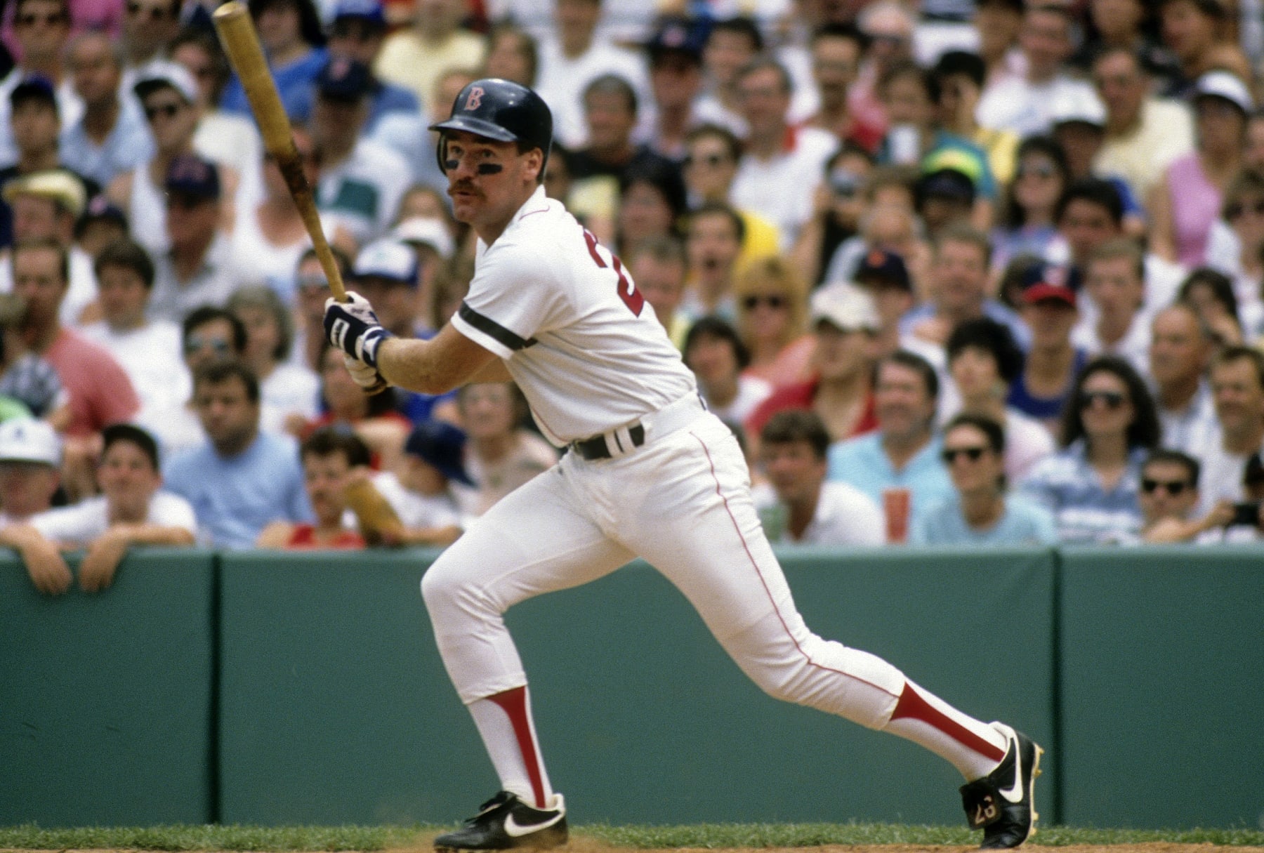 BOSTON, MA - CIRCA 1980's: Third Baseman Wade Boggs #26 of the Boston Red Sox swings and watches the flight of his ball during a circa mid 1980's Major League Baseball game at Fenway Park in Boston, Massachusetts. Boggs played for the Red Sox from 1982-92. (Photo by Focus on Sport/Getty Images)