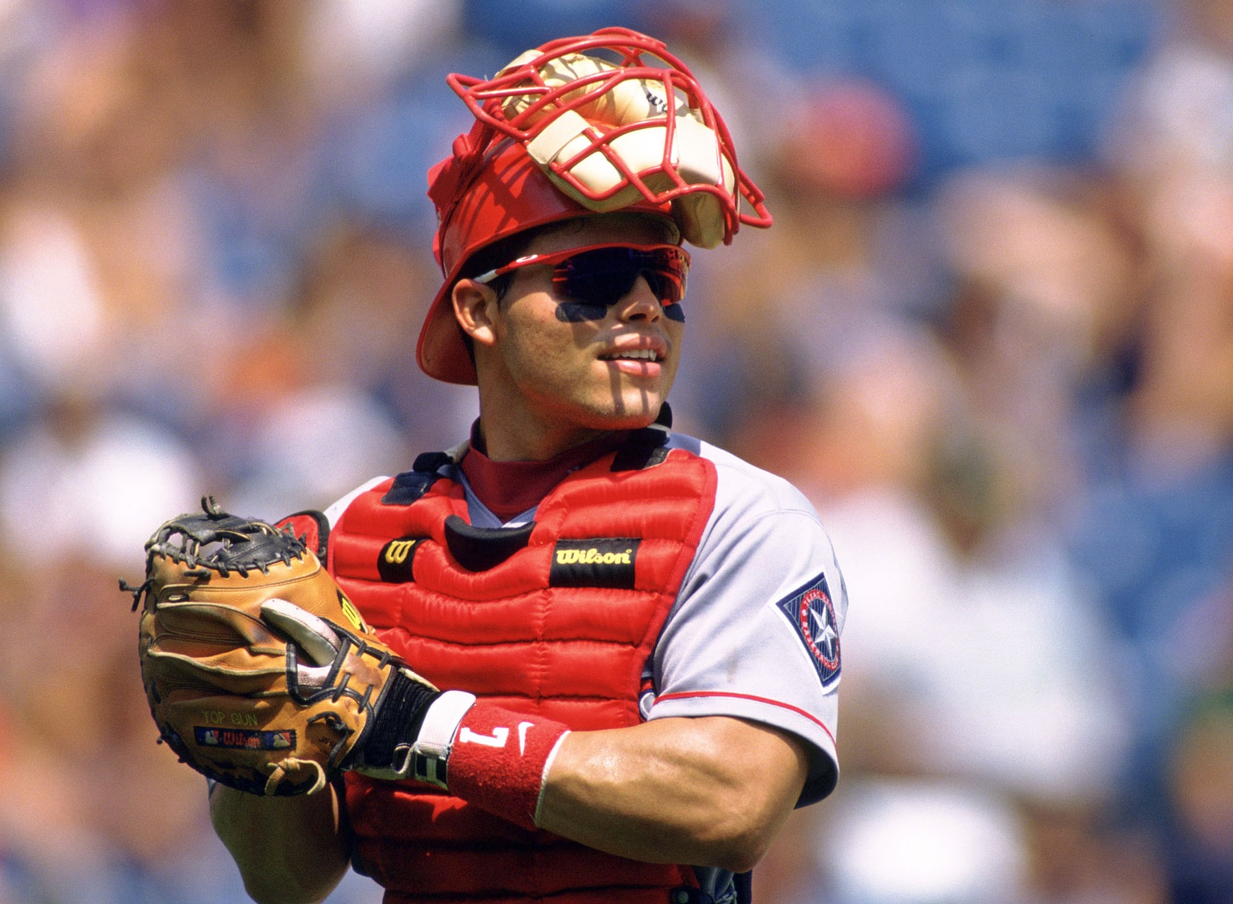 CHICAGO - CIRCA 1997:  Ivan Rodriguez #7 of the Texas Rangers looks on during an MLB game at Comiskey Park in Chicago, Illinois. Rodriguez played for 21 years, with 6 different teams, was a 14-time All-Star, was American League MVP in 1999 and was inducted to the Baseball Hall of Fame in 2017. (Photo by SPX/Ron Vesely Photography via Getty Images)