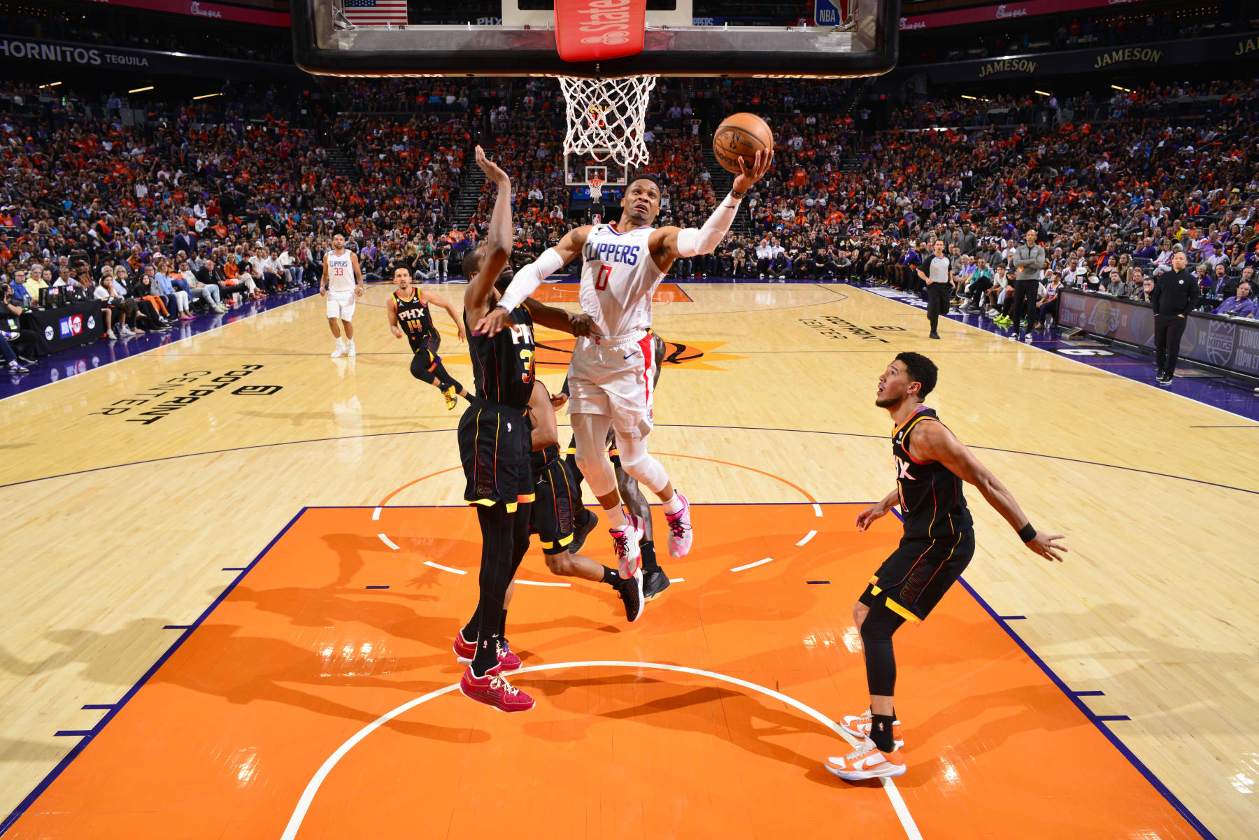 PHOENIX, AZ - APRIL 25: Russell Westbrook  #0 of the LA Clippers drives to the basket during the game against the Phoenix Suns during Round 1 Game 5 of the 2023 NBA Playoffs on April 25, 2023 at Footprint Center in Phoenix, Arizona. NOTE TO USER: User expressly acknowledges and agrees that, by downloading and or using this photograph, user is consenting to the terms and conditions of the Getty Images License Agreement. Mandatory Copyright Notice: Copyright 2023 NBAE (Photo by Barry Gossage/NBAE via Getty Images)