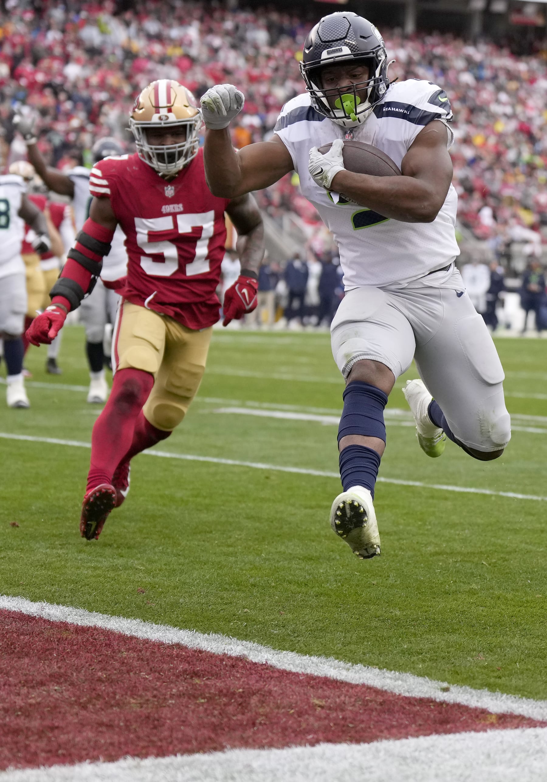 SANTA CLARA, CALIFORNIA - JANUARY 14: Kenneth Walker III #9 of the Seattle Seahawks runs the ball to score a 7 yard touchdown against the San Francisco 49ers during the second quarter in the NFC Wild Card playoff game at Levi's Stadium on January 14, 2023 in Santa Clara, California. (Photo by Thearon W. Henderson/Getty Images)