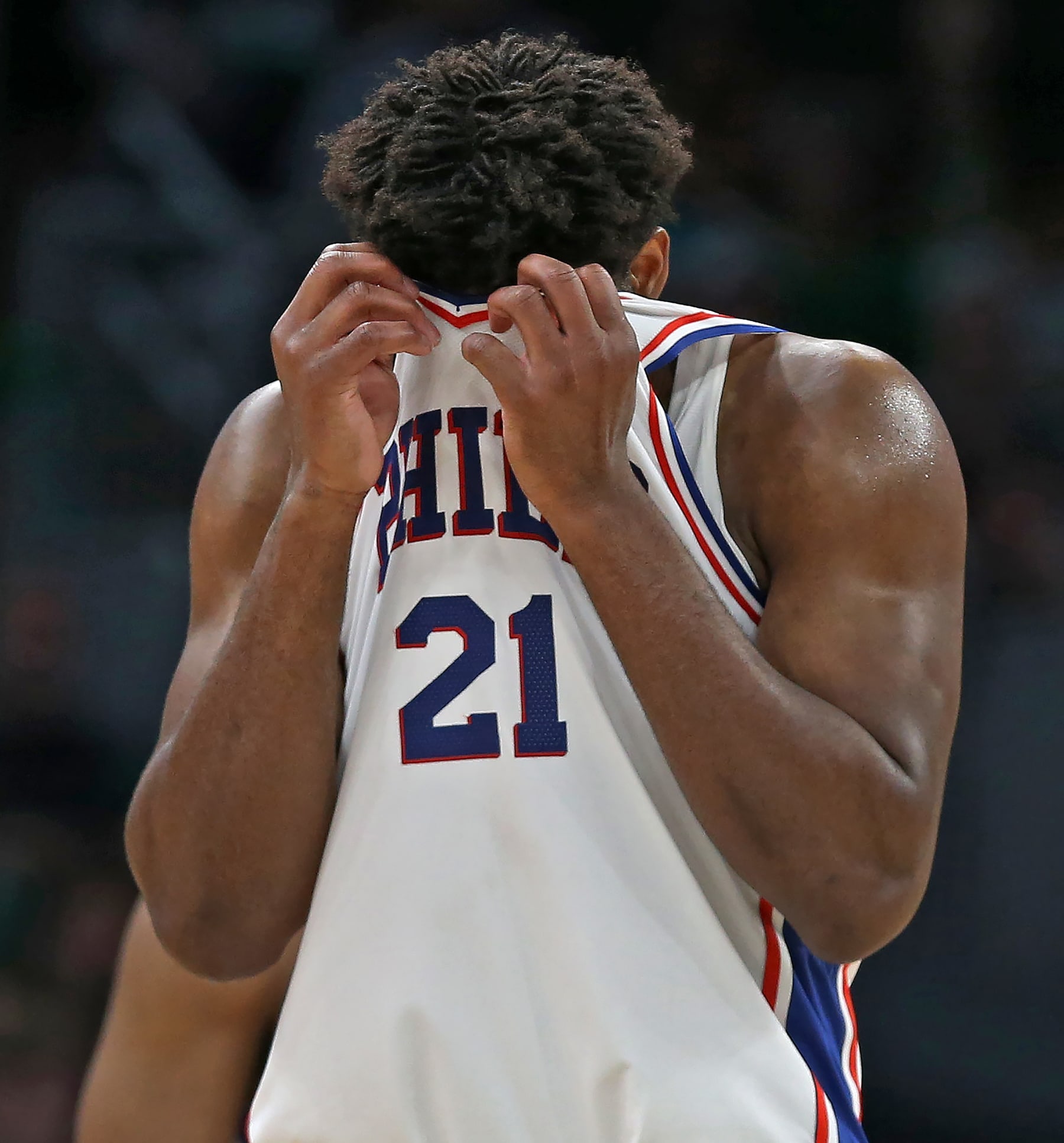 Boston, MA - May 14: Philadelphia 76ers C Joel Embiid pulls his jersey up over his eyes in the fourth quarter. The Boston Celtics defeated the 76ers, 112-88, in Game 7 of the 2023 Eastern Conference Semifinals. (Photo by Jim Davis/The Boston Globe via Getty Images)