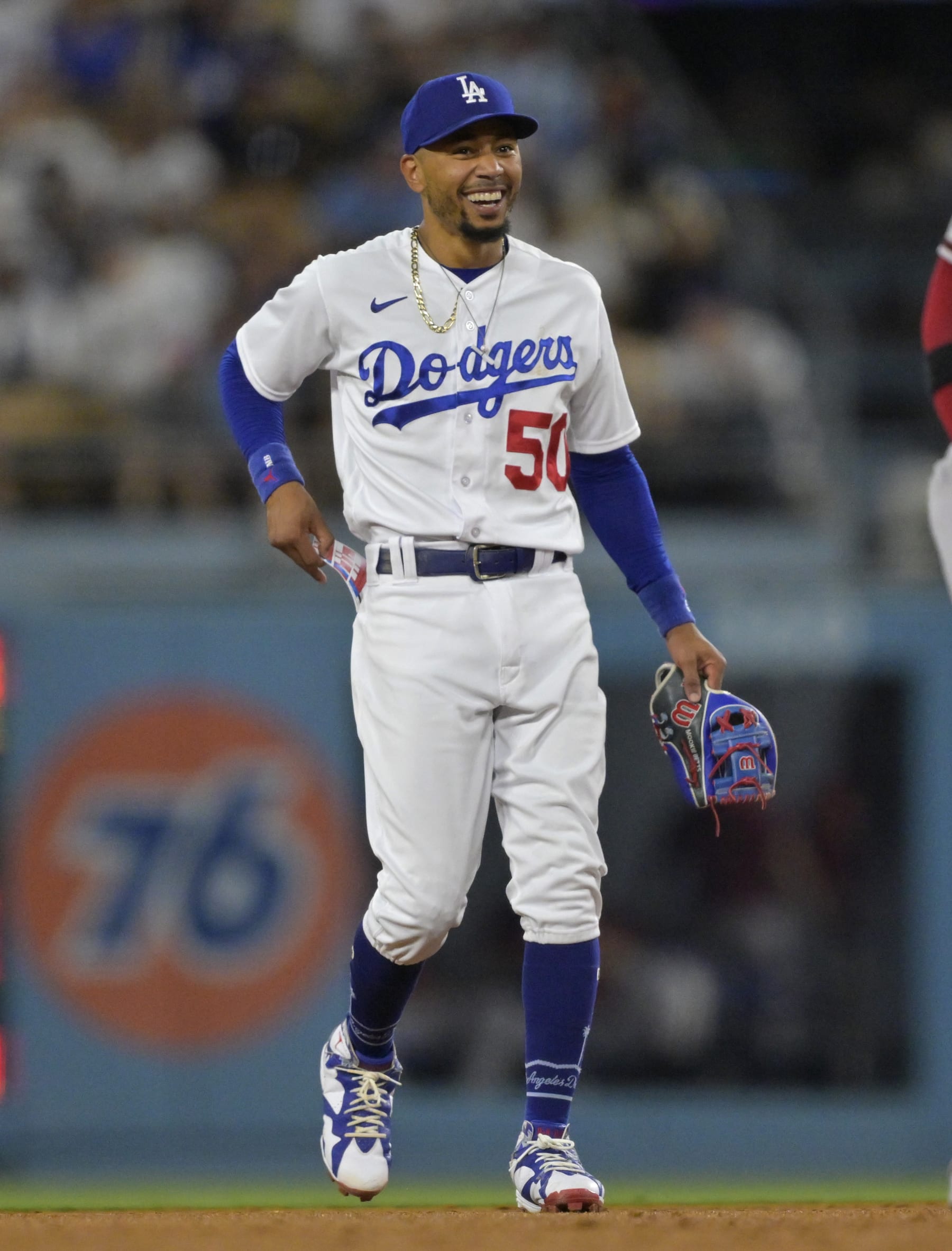LOS ANGELES, CALIFORNIA - AUGUST 28: Mookie Betts #50 of the Los Angeles Dodgers laughs with Ketel Marte #4 of the Arizona Diamondbacks during the game at Dodger Stadium on August 28, 2023 in Los Angeles, California. (Photo by Jayne Kamin-Oncea/Getty Images)
