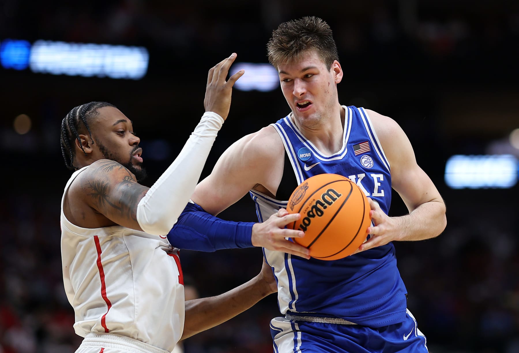 DALLAS, TEXAS - MARCH 29:  Kyle Filipowski #30 of the Duke Blue Devils drives as J'Wan Roberts #13 of the Houston Cougars defends during the second half of the Sweet 16 round of the NCAA Men's Basketball Tournament at American Airlines Center on March 29, 2024 in Dallas, Texas. (Photo by Patrick Smith/Getty Images)