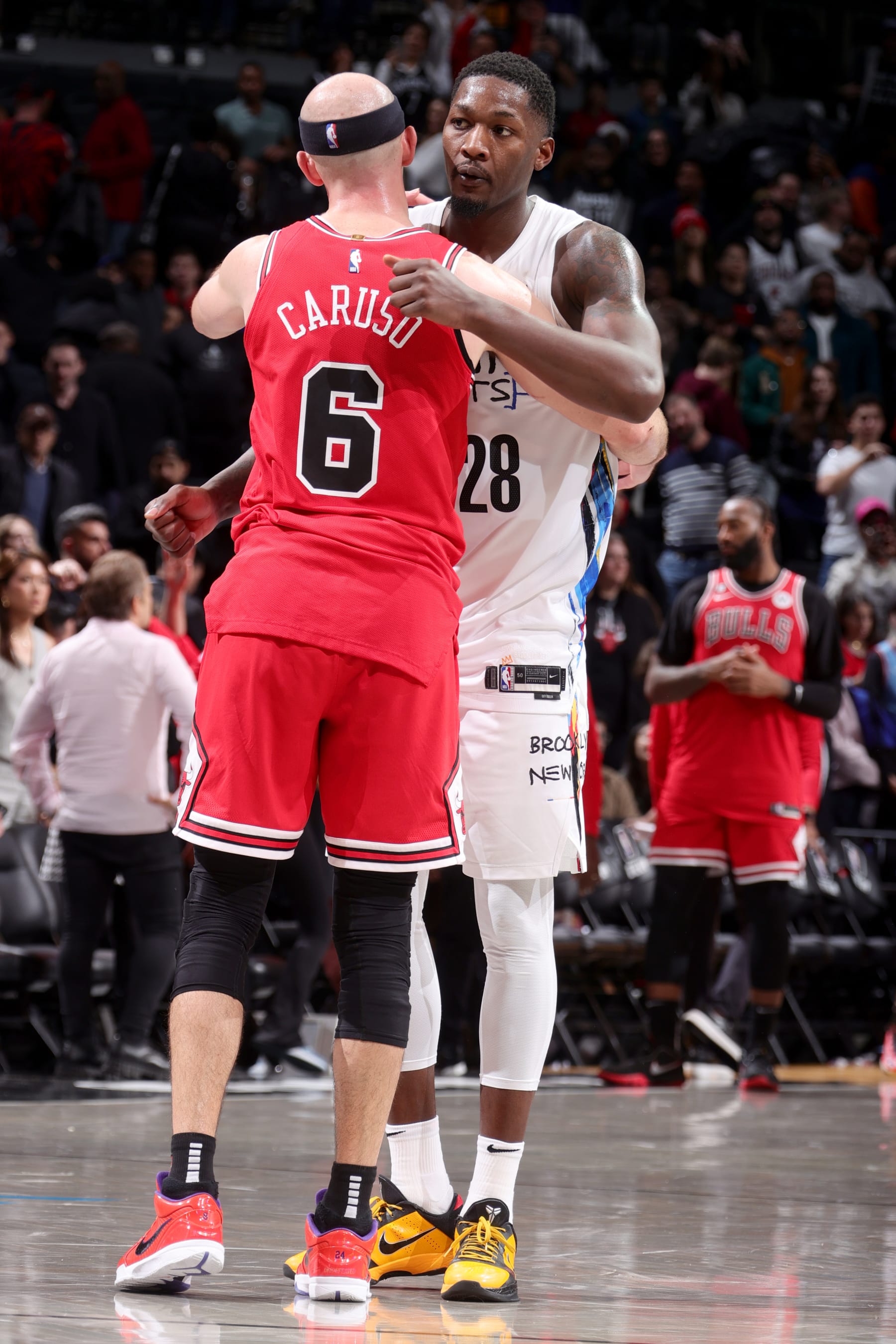 BROOKLYN, NY - FEBRUARY 9: Dorian Finney-Smith #28 of the Brooklyn Nets embraces Alex Caruso #6 of the Chicago Bulls after the game on February 9, 2023 at Barclays Center in Brooklyn, New York. NOTE TO USER: User expressly acknowledges and agrees that, by downloading and or using this Photograph, user is consenting to the terms and conditions of the Getty Images License Agreement. Mandatory Copyright Notice: Copyright 2023 NBAE (Photo by Nathaniel S. Butler/NBAE via Getty Images)