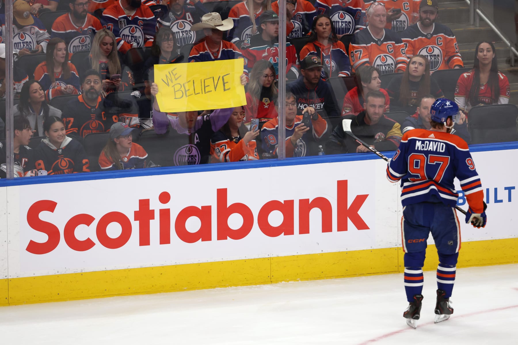 EDMONTON, CANADA - JUNE 15: A fan holds an inspirational poster while Connor McDavid #97 of the Edmonton Oilers skates past during the first period of Game Four of the 2024 Stanley Cup Final against the Florida Panthers at Rogers Place on June 15, 2024 in Edmonton, Alberta, Canada. (Photo by Harry How/Getty Images)