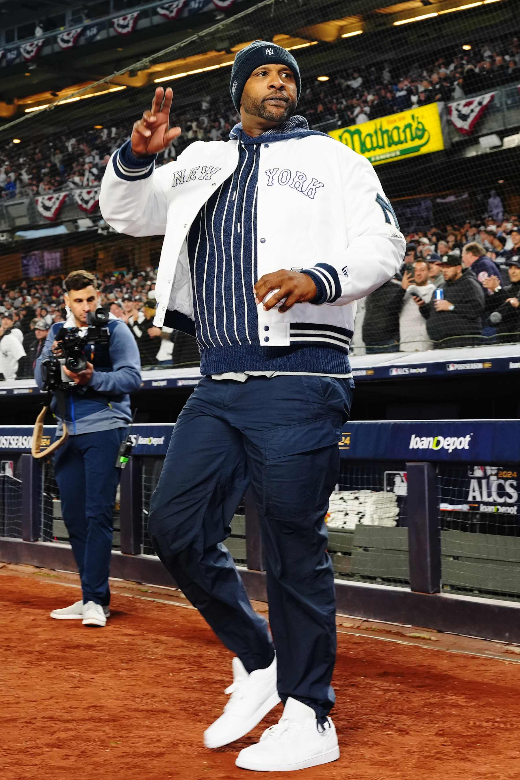 NEW YORK, NY - OCTOBER 14:  Former New York Yankees player CC Sabathia acknowledges the crowd prior to Game 1 of the ALCS presented by loanDepot between the Cleveland Guardians and the New York Yankees at Yankee Stadium on Monday, October 14, 2024 in New York, New York. (Photo by Mary DeCicco/MLB Photos via Getty Images)