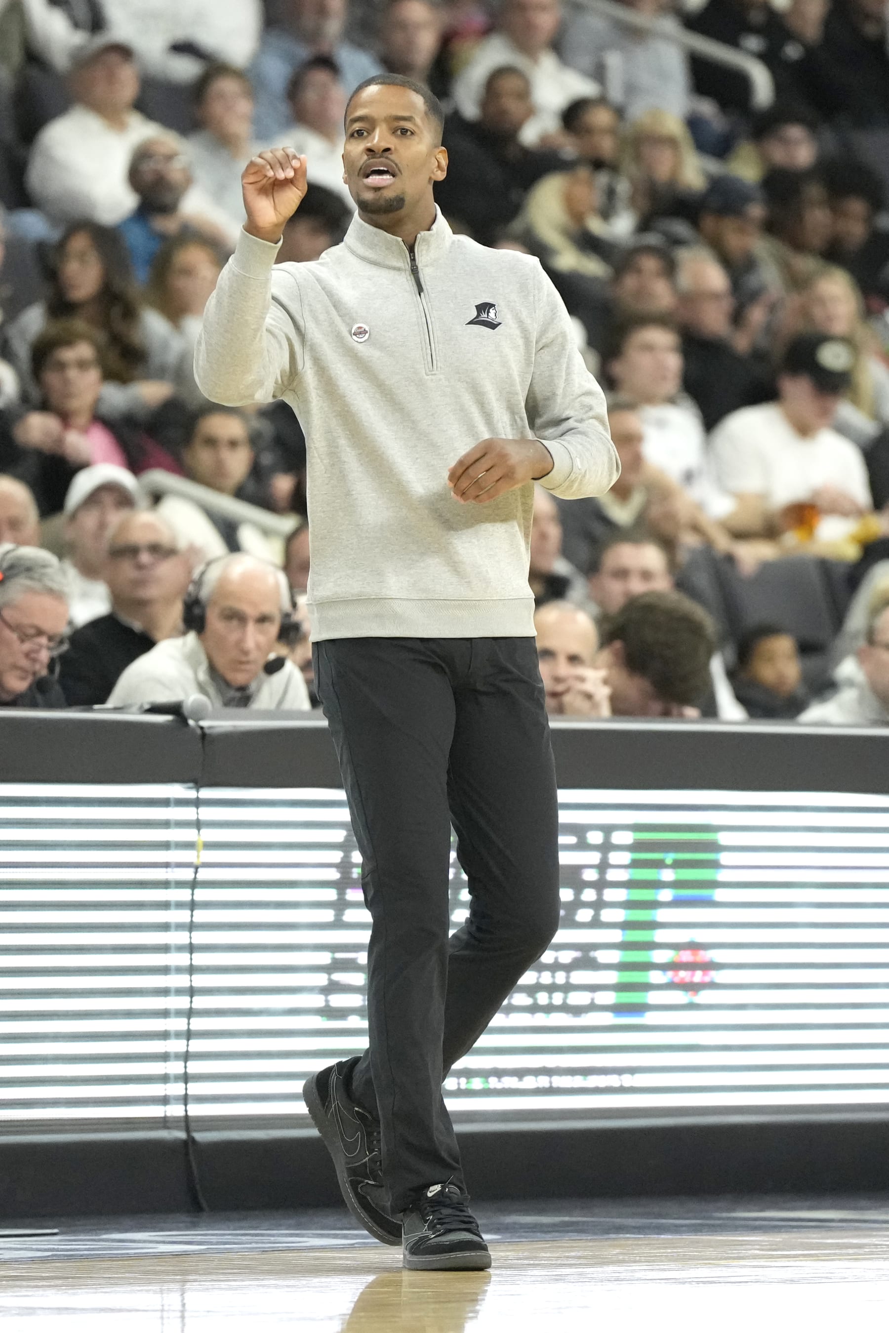 PROVIDENCE, RI - NOVEMBER 14:  Head coach Kim English of the Providence Friars signals to his players during a college basketball game against the Wisconsin Badgers at Amica Mutual Pavilion on November 14, 2023 in Providence, Rhode Island.  (Photo by Mitchell Layton/Getty Images)