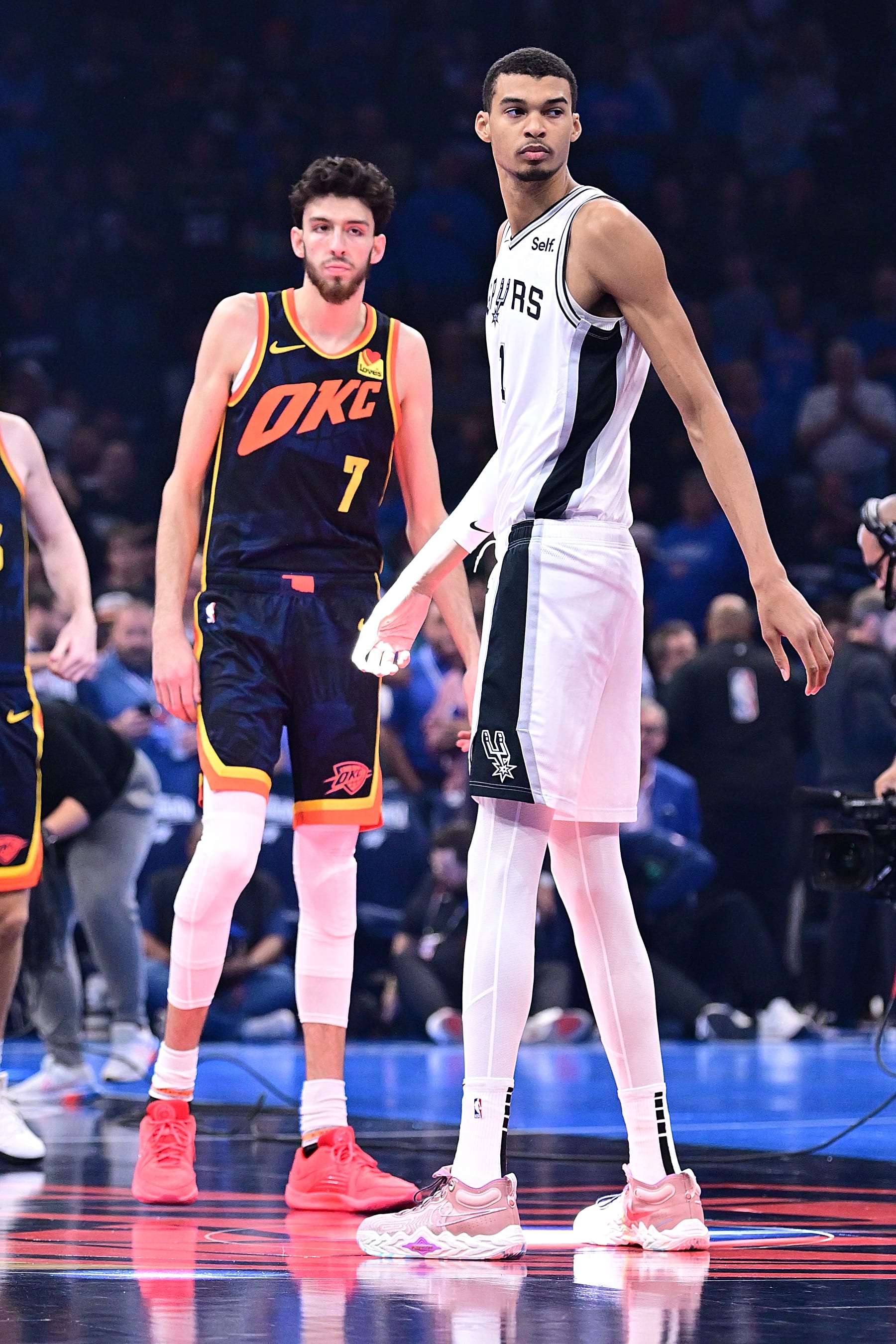 OKLAHOMA CITY, OKLAHOMA - NOVEMBER 14: Chet Holmgren #7 of the Oklahoma City Thunder and Victor Wembanyama #1 of the San Antonio Spurs wait for tipoff during the first half of an NBA In-Season Tournament game at Paycom Center on November 14, 2023 in Oklahoma City, Oklahoma. NOTE TO USER: User expressly acknowledges and agrees that, by downloading and or using this photograph, User is consenting to the terms and conditions of the Getty Images License Agreement. (Photo by Joshua Gateley/Getty Images)