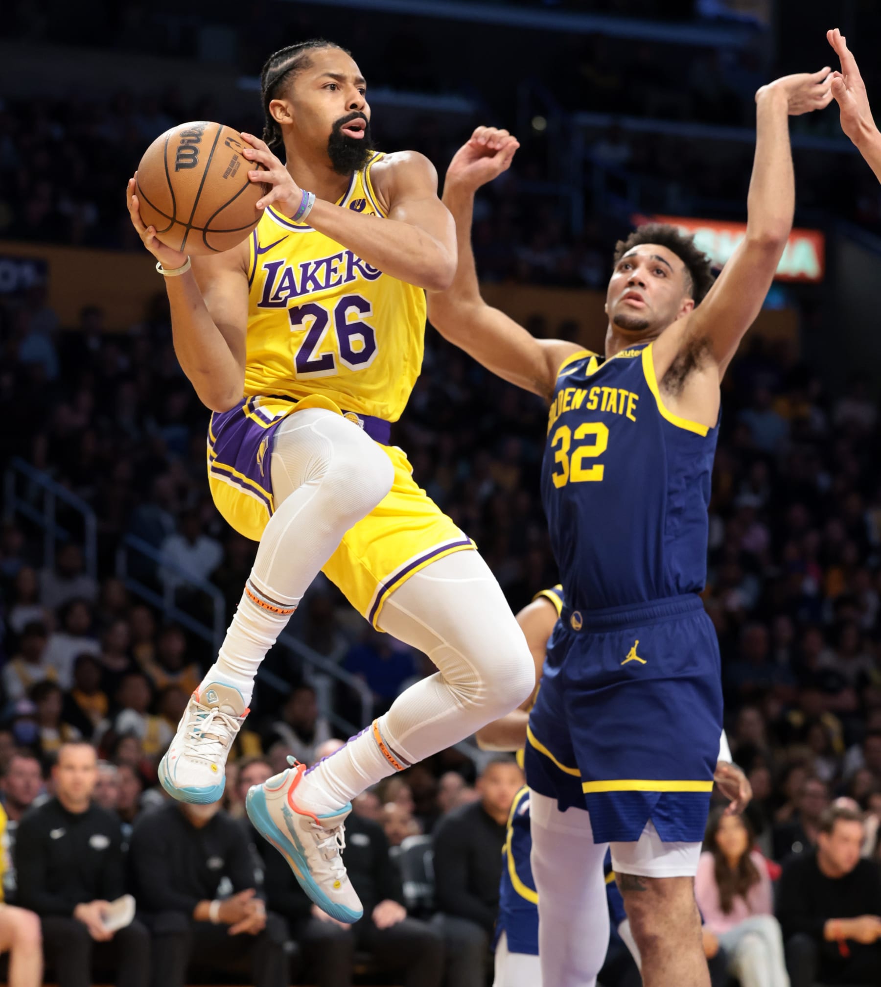 LOS ANGELES, CALIFORNIA - APRIL 9:  Lakers Spencer Dinwiddie gets a pass off in front of Warriors Trayce Jackson-Davis in the third quarter at Crypto.com Arena Tuesday. (Wally Skalij/Los Angeles Times via Getty Images)