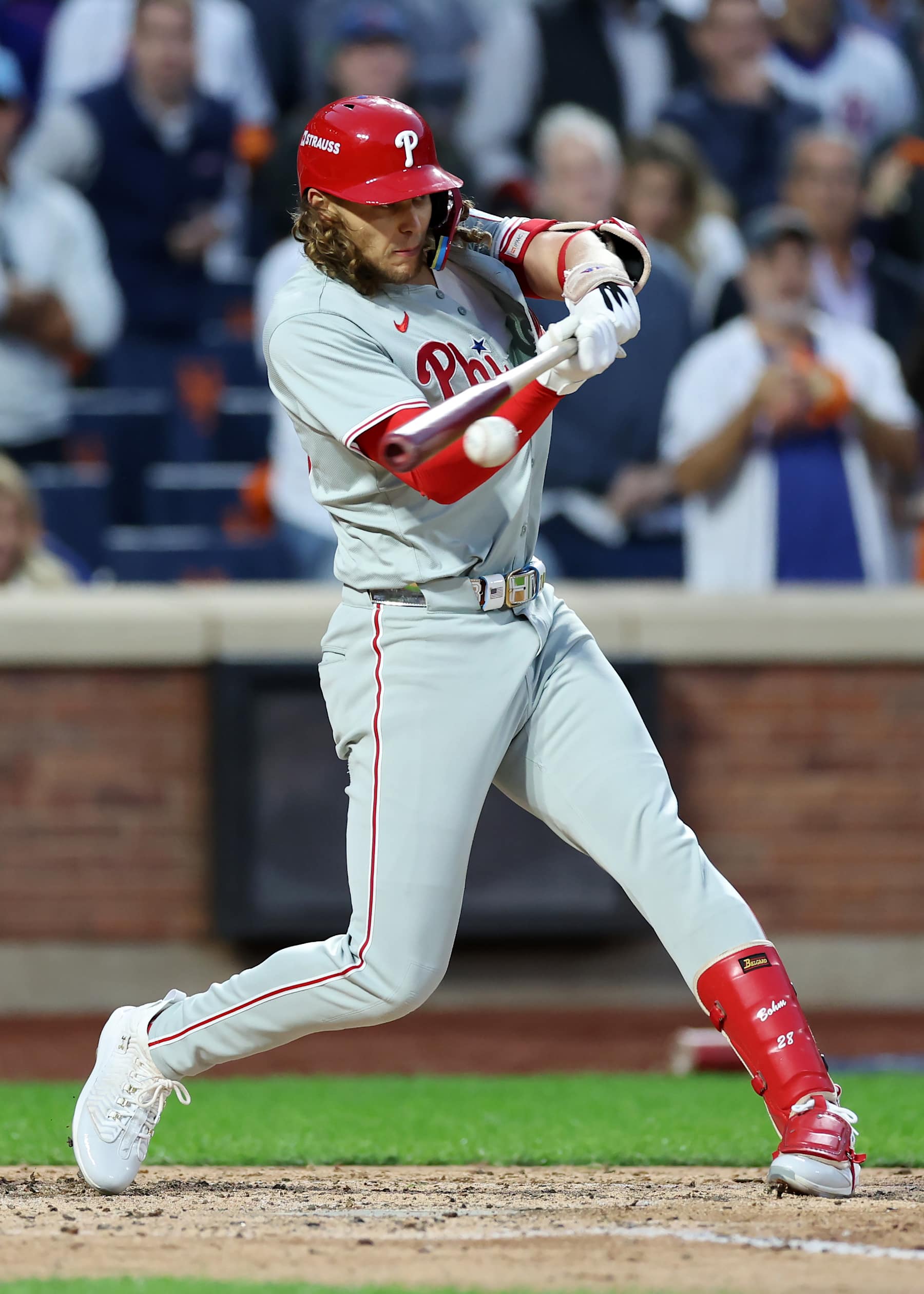 NEW YORK, NEW YORK - OCTOBER 09: Alec Bohm #28 of the Philadelphia Phillies reaches on a fielder's choice in the fourth inning against the New York Mets during Game Four of the Division Series at Citi Field on October 09, 2024 in New York City. (Photo by Luke Hales/Getty Images)