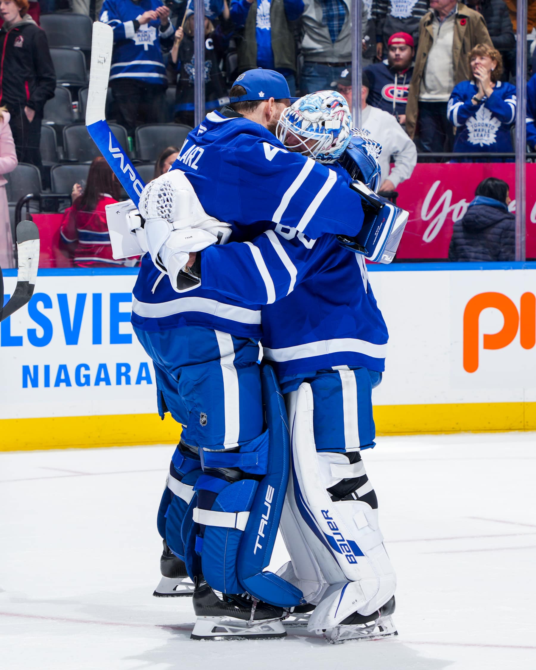 TORONTO, ON - NOVEMBER 9: Anthony Stolarz #41 of the Toronto Maple Leafs hugs teammate Joseph Woll #60 after defeating the Montreal Canadiens at Scotiabank Arena on November 9, 2024 in Toronto, Ontario, Canada. (Photo by Mark Blinch/NHLI via Getty Images)