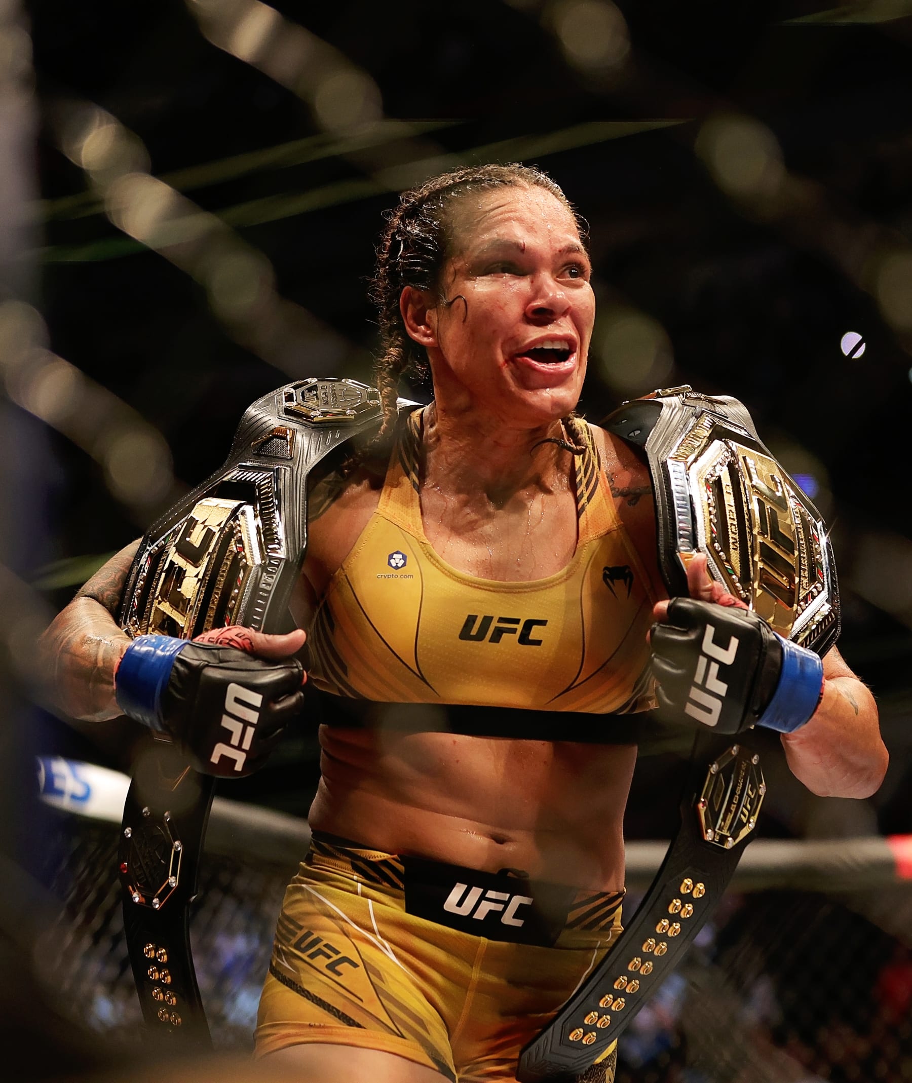 DALLAS, TEXAS - JULY 30: Amanda Nunes of Brazil celebrates after defeating Julianna Pena in their bantamweight title bout during UFC 277 at American Airlines Center on July 30, 2022 in Dallas, Texas. Amanda Nunes won via unanimous decision. (Photo by Carmen Mandato/Getty Images)