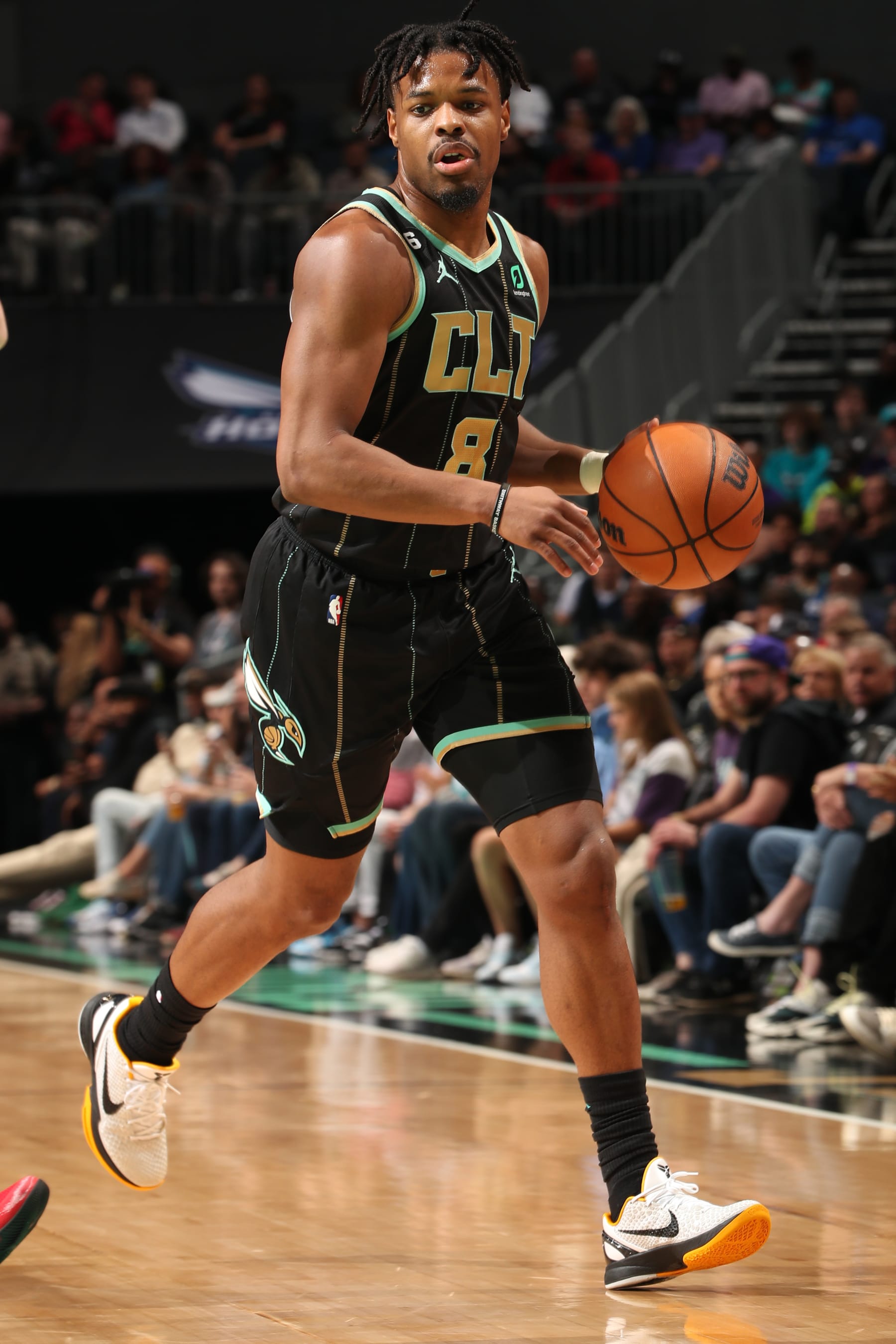 CHARLOTTE, NC - MARCH 26: Dennis Smith Jr. #8 of the Charlotte Hornets dribbles the ball during the game against the Dallas Mavericks on March 26, 2023 at Spectrum Center in Charlotte, North Carolina. NOTE TO USER: User expressly acknowledges and agrees that, by downloading and or using this photograph, User is consenting to the terms and conditions of the Getty Images License Agreement. Mandatory Copyright Notice: Copyright 2023 NBAE (Photo by Kent Smith/NBAE via Getty Images)