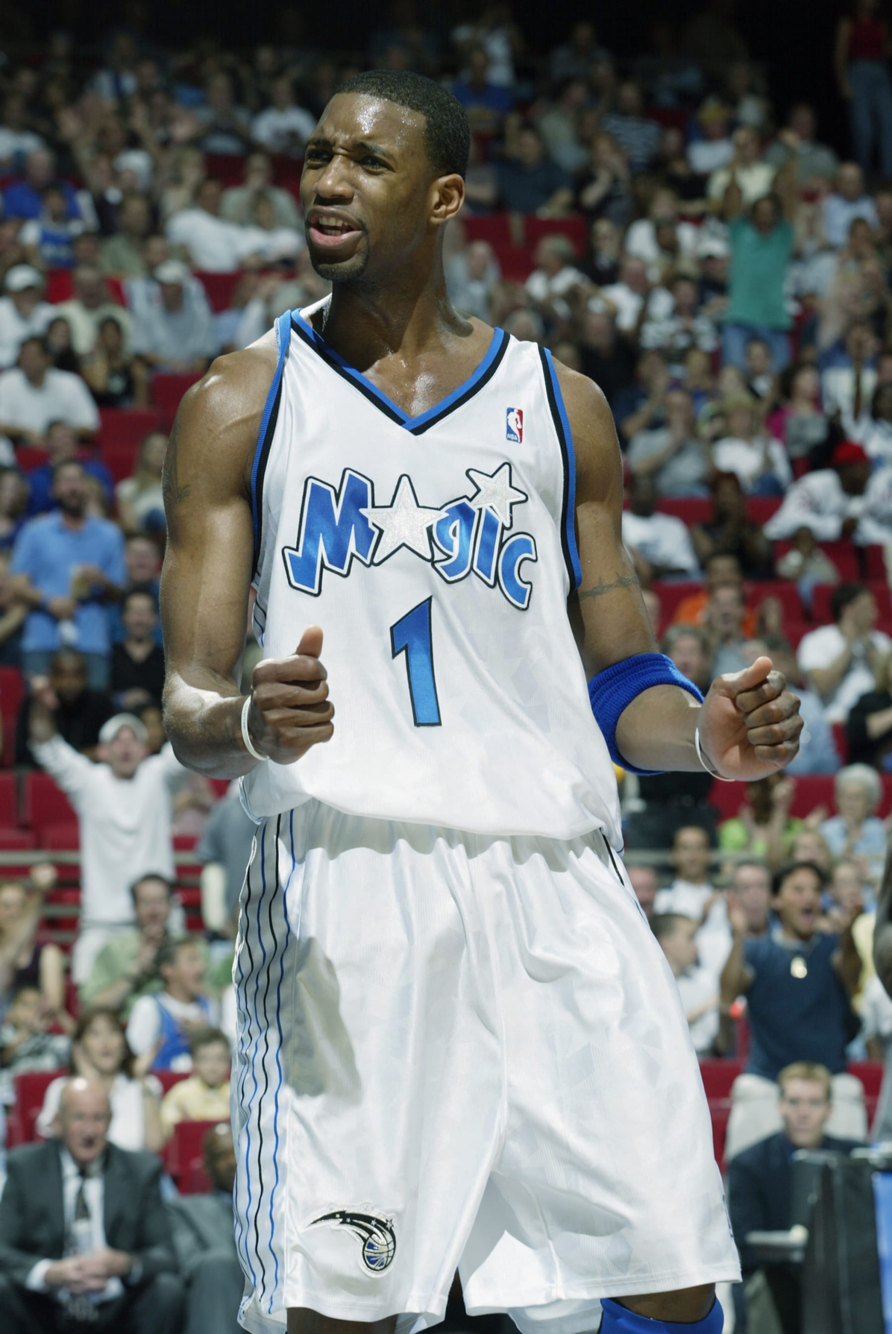 ORLANDO, FL - MARCH 21:  Tracy McGrady #1 of the Orlando Magic celebrates during the NBA game against the Cleveland Cavaliers at TD Waterhouse Centre on March 21, 2003 in Orlando, Florida.  The Magic won 109-85.   NOTE TO USER:  User expressly acknowledges and agrees that, by downloading and or using this Photograph, User is consenting to the terms and conditions of the Getty Images License Agreement.  Mandatory Copyright Notice:  Copyright 2003 NBAE  (Photo by Tony Firriolo/NBAE via Getty Images)  