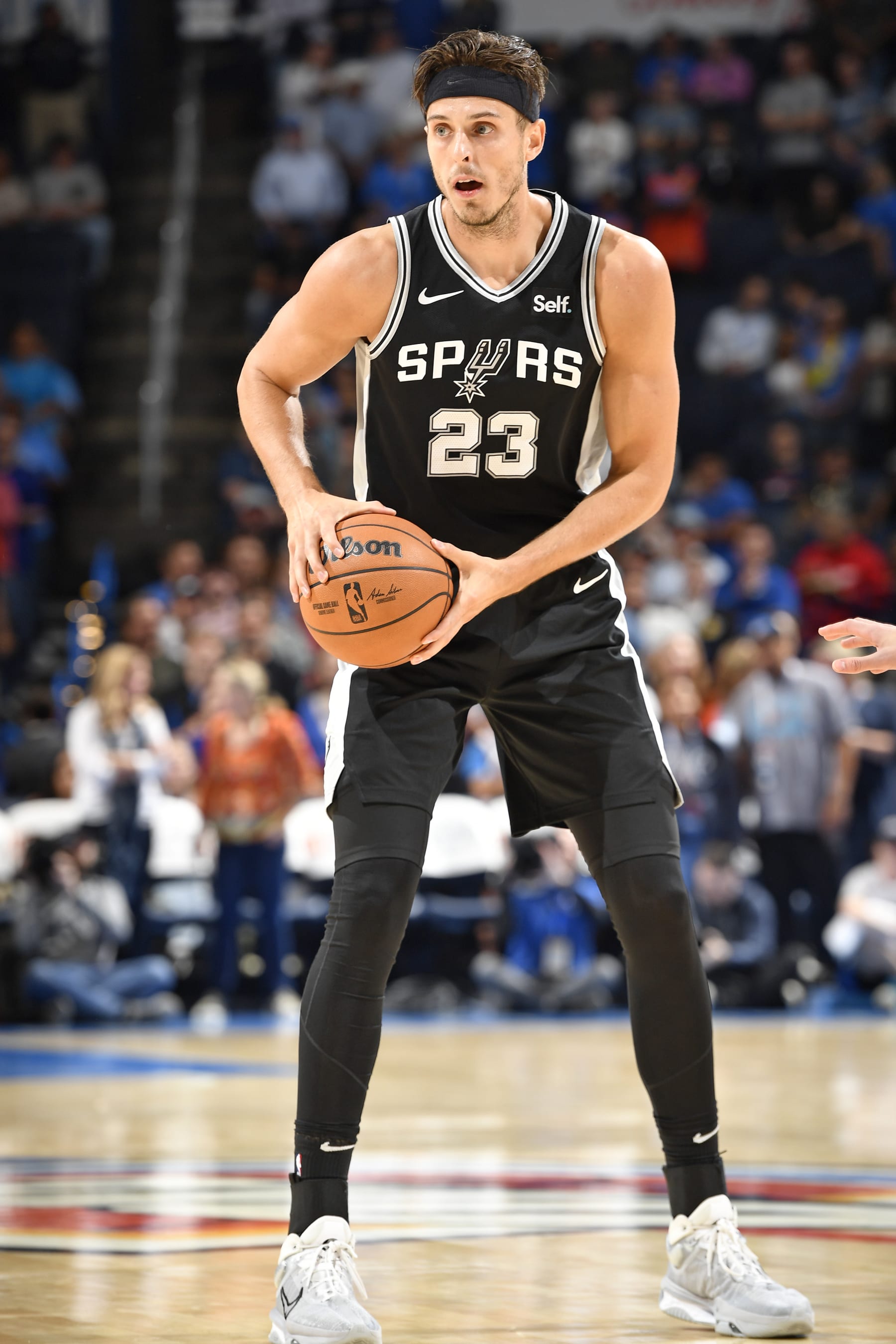 OKLAHOMA CITY, OK - OCTOBER 9: Zach Collins #23 of the San Antonio Spurs looks to pass the ball during the game against the Oklahoma City Thunder on October 9, 2023 at the Paycom Center in Oklahoma City, OK. NOTE TO USER: User expressly acknowledges and agrees that, by downloading and or using this photograph, User is consenting to the terms and conditions of the Getty Images License Agreement. Mandatory Copyright Notice: Copyright 2023 NBAE (Photo by Logan Riely/NBAE via Getty Images)