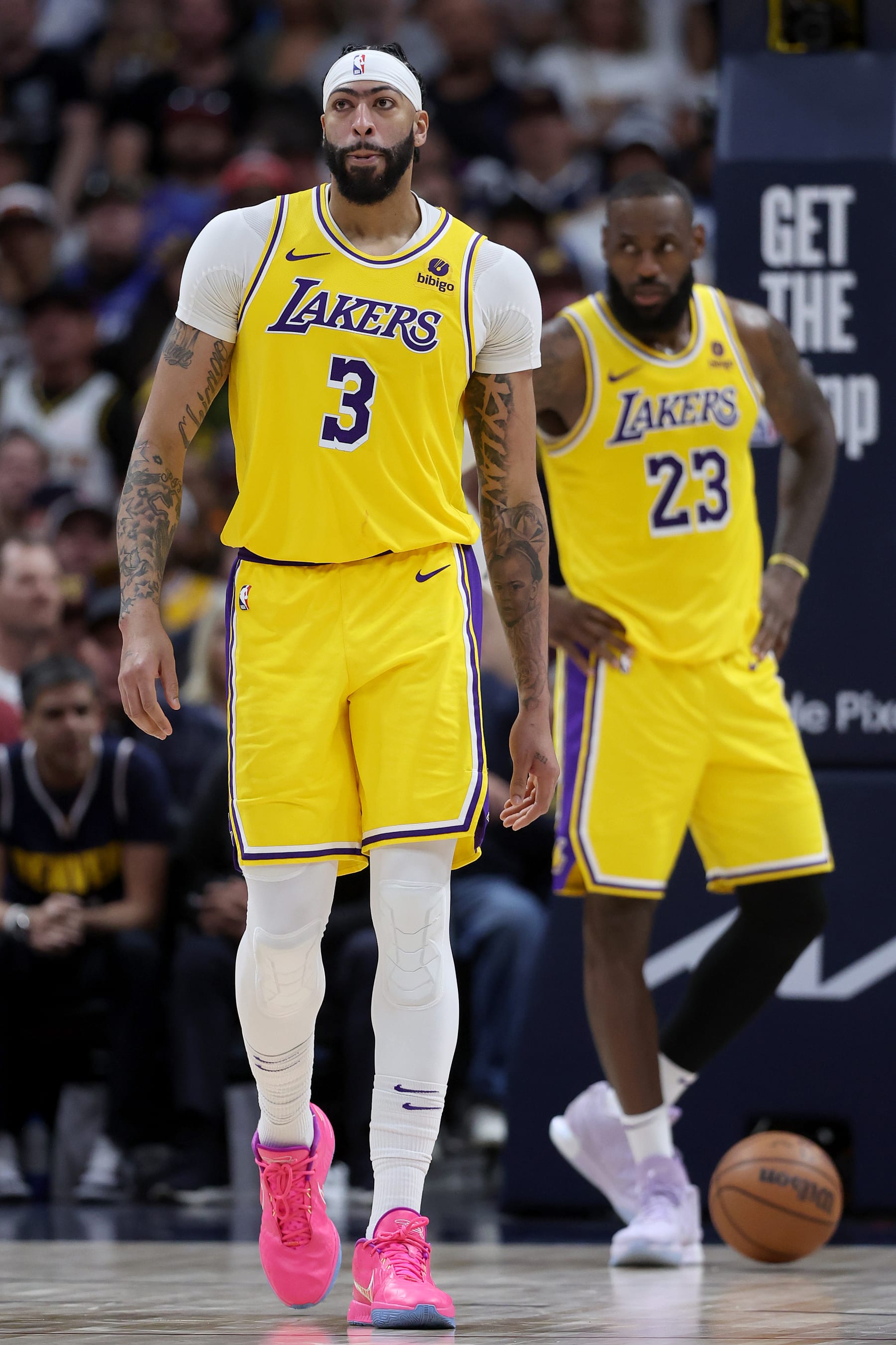DENVER, COLORADO - APRIL 22: Anthony Davis #3 and LeBron James #23 of the Los Angeles Lakers react after a basket by the Denver Nuggets in the fourth quarter during game two of the Western Conference First Round Playoffs at Ball Arena on April 22, 2024 in Denver, Colorado. NOTE TO USER: User expressly acknowledges and agrees that, by downloading and or using this photograph, User is consenting to the terms and conditions of the Getty Images License Agreement. (Photo by Matthew Stockman/Getty Images)