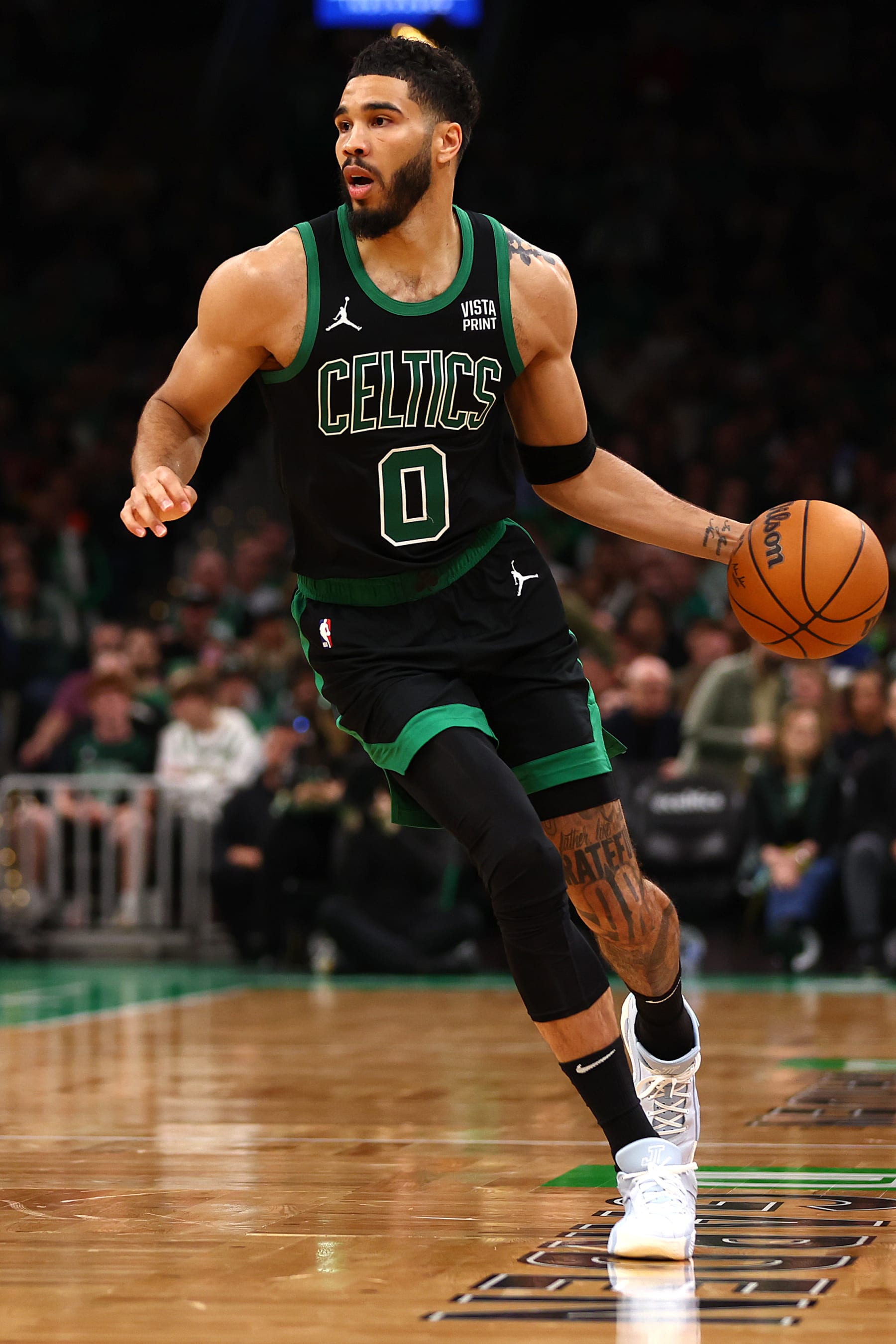 BOSTON, MASSACHUSETTS - MAY 01: Jayson Tatum #0 of the Boston Celtics dribbles against the Miami Heat  during the third quarter of game five of the Eastern Conference First Round Playoffs at TD Garden on May 01, 2024 in Boston, Massachusetts. NOTE TO USER: User expressly acknowledges and agrees that, by downloading and/or using this Photograph, user is consenting to the terms and conditions of the Getty Images License Agreement.  (Photo by Maddie Meyer/Getty Images)