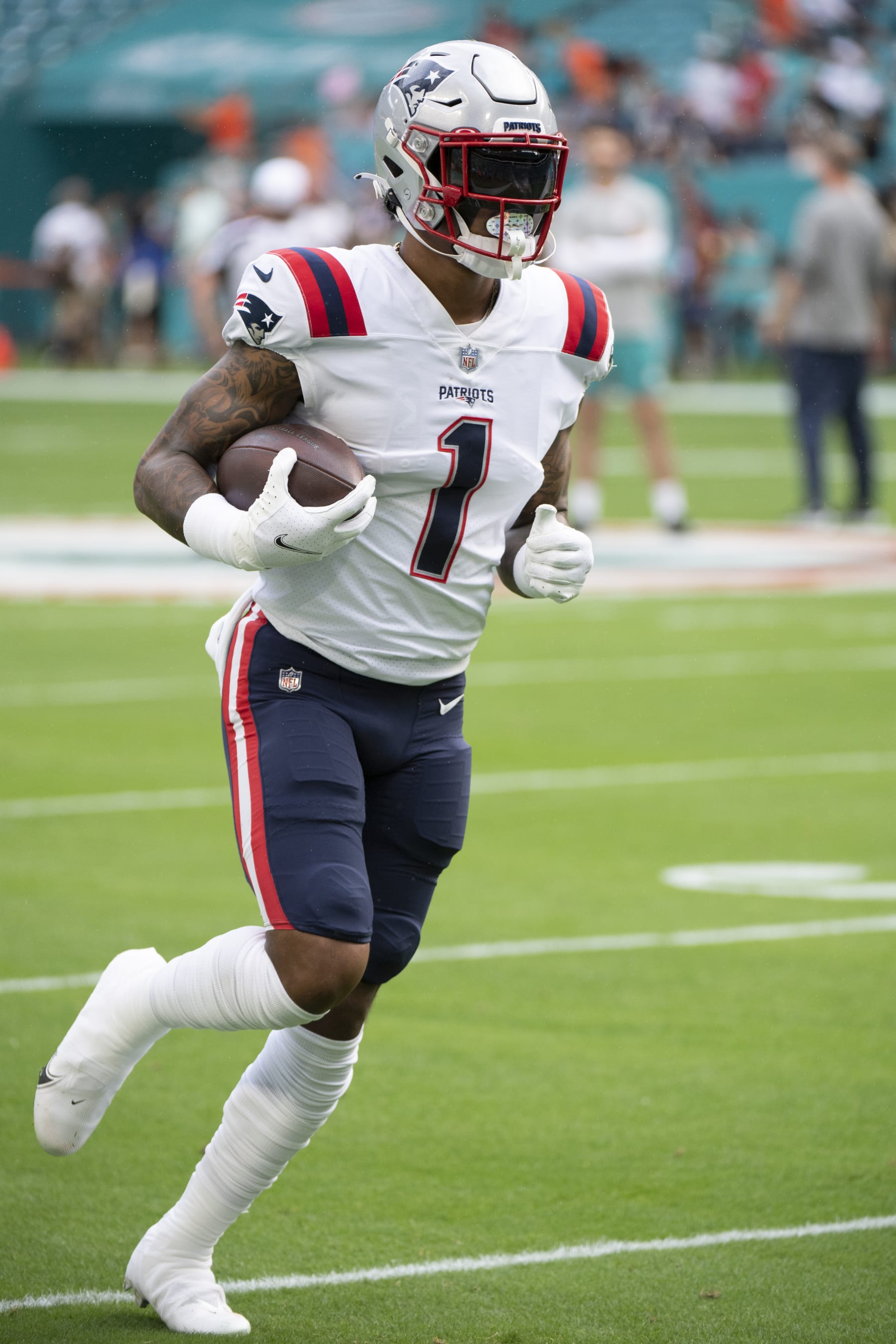 New England Patriots wide receiver N'Keal Harry (1) runs with the ball on the field before an NFL football game against the Miami Dolphins, Sunday, Jan. 9, 2022, in Miami Gardens, Fla. (AP Photo/Doug Murray)