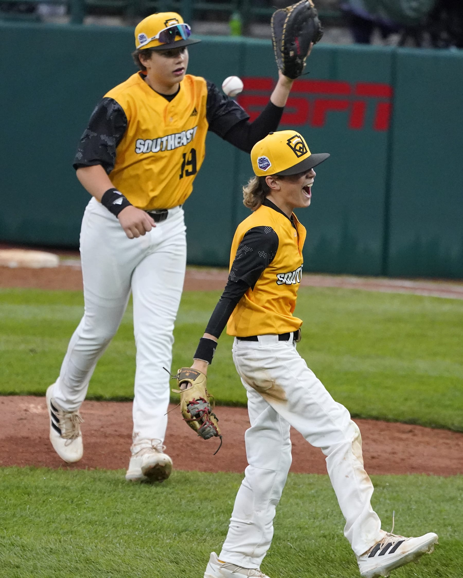 Nolensville, Tenn.'s Grayson May, right, and Wright Martin (19) celebrate after getting the final out of a 5-3 win over Middleborough, Mass., in Little League World Series baseball game in South Williamsport, Pa., Wednesday, Aug. 17, 2022. (AP Photo/Gene J. Puskar)